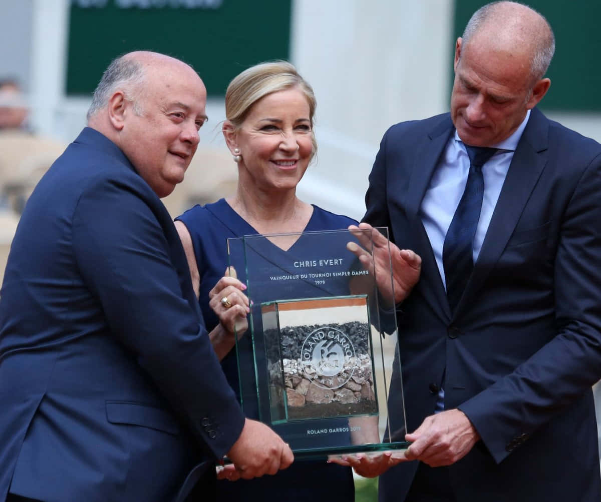 Chris Evert Receiving A Plaque Background