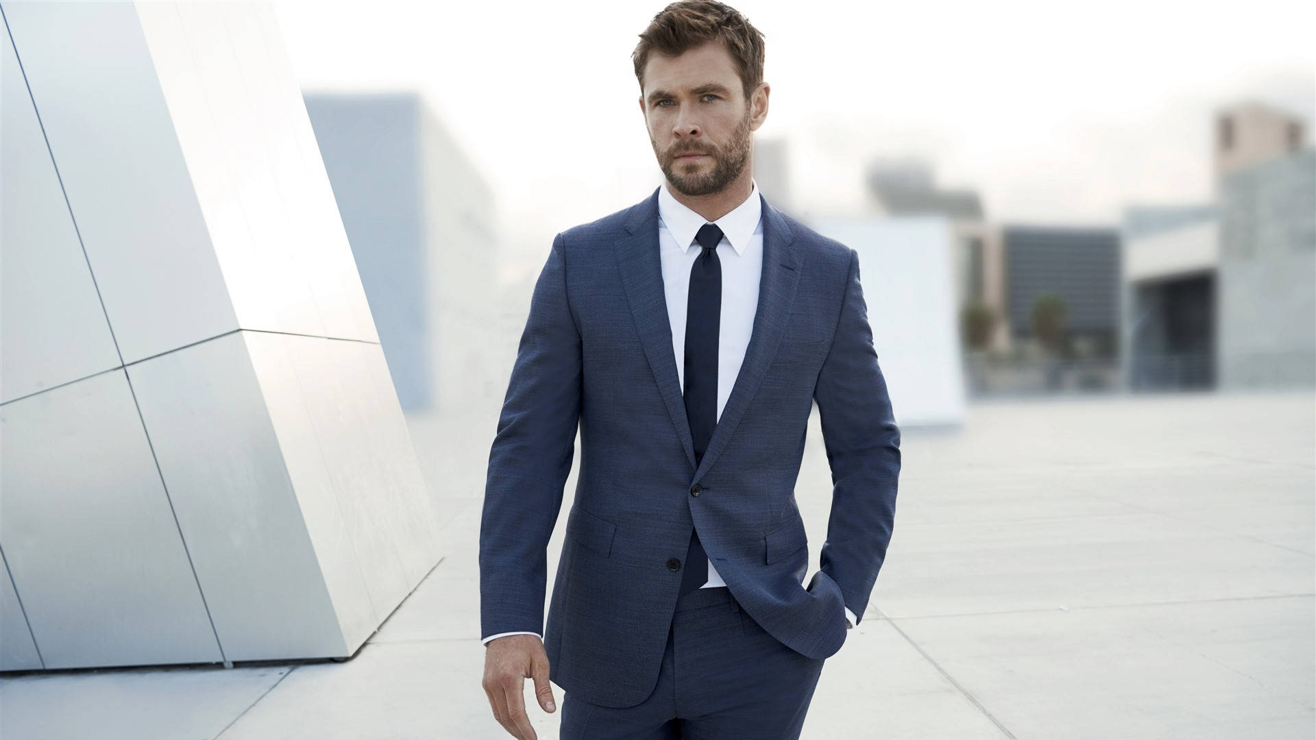 Chris Hemsworth Looks Confident And Powerful In A Suit. Background