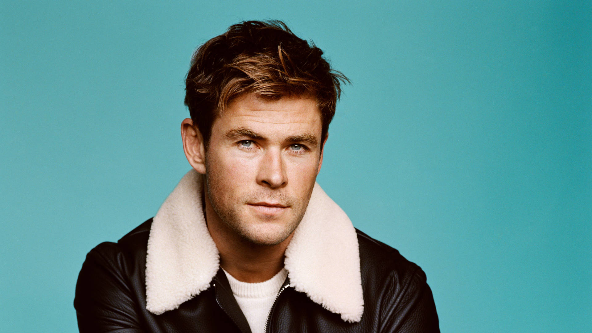 Chris Hemsworth Looks Dapper In A Fur And Leather Jacket. Background