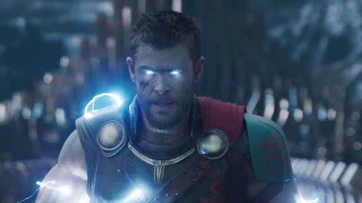 Chris Hemsworth's Intense Gaze With Glowing Blue Eyes. Background