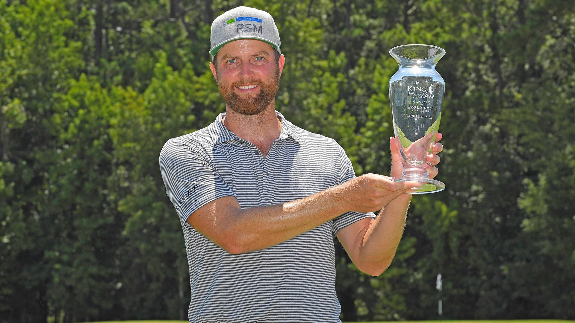 Chris Kirk Showing Off His Trophy Background