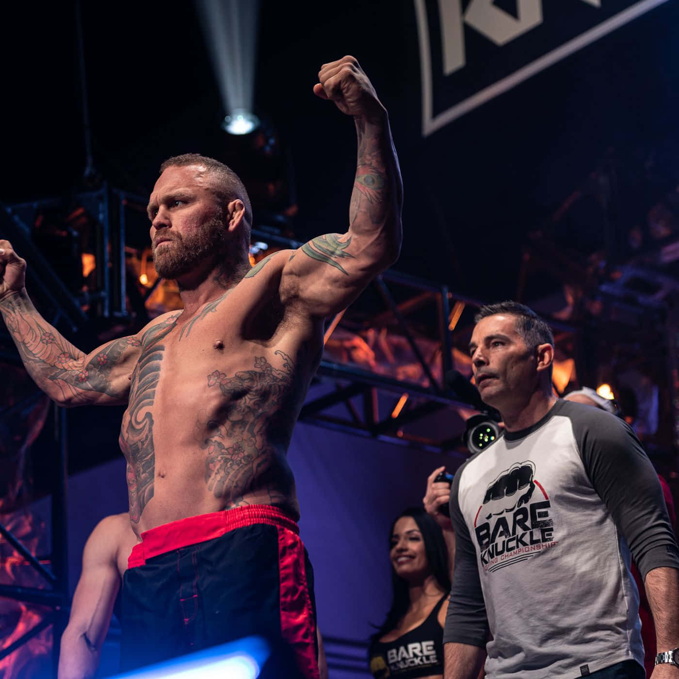 Chris Leben Demonstrating Well-built Physique And Unique Tattoos Background