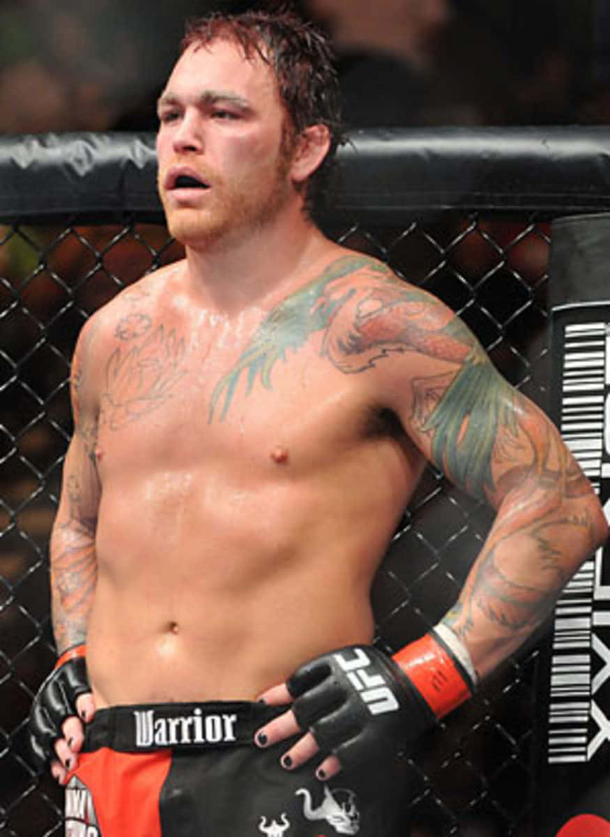 Chris Leben Standing Inside The Octagon Background