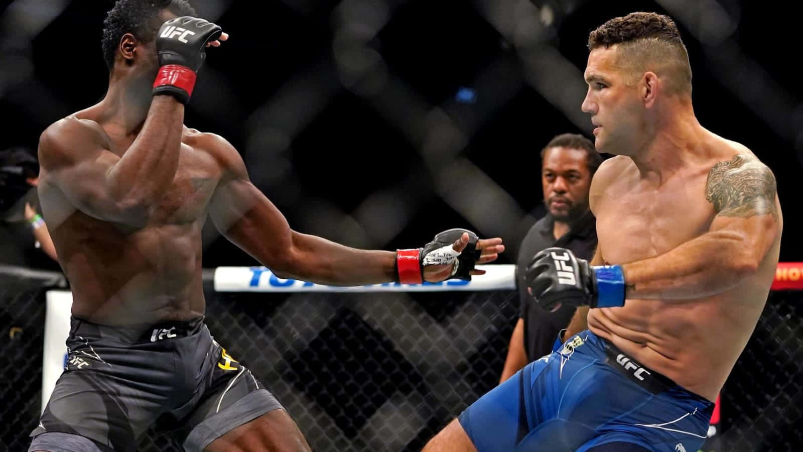 Chris Weidman Battles Uriah Hall In Ufc Match Background