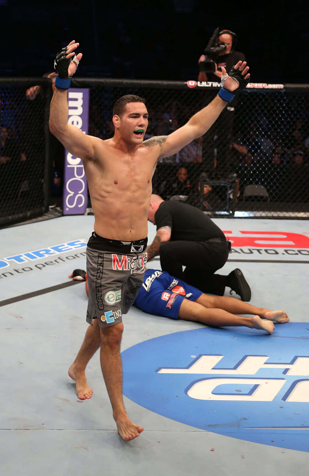 Chris Weidman Celebrates A Victory Background