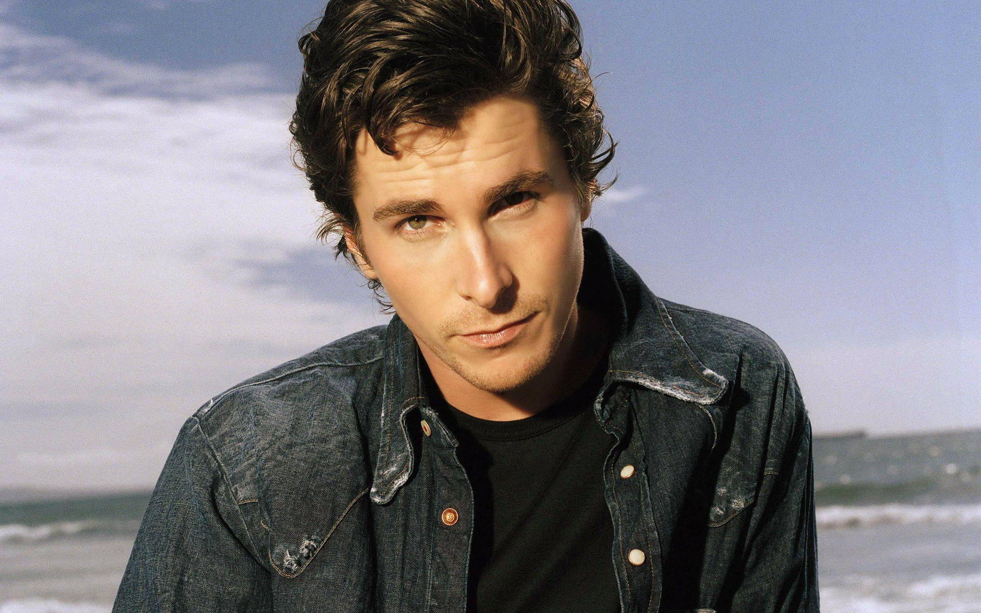 Christian Bale In Denim Background