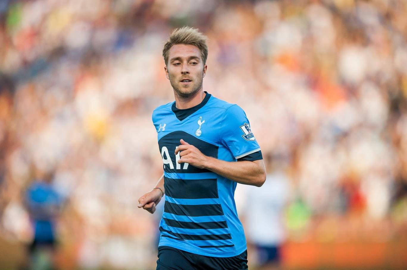 Christian Eriksen In A Blue Uniform Background