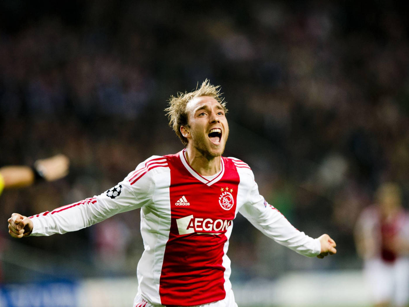 Christian Eriksen Running In White And Red Uniform Background