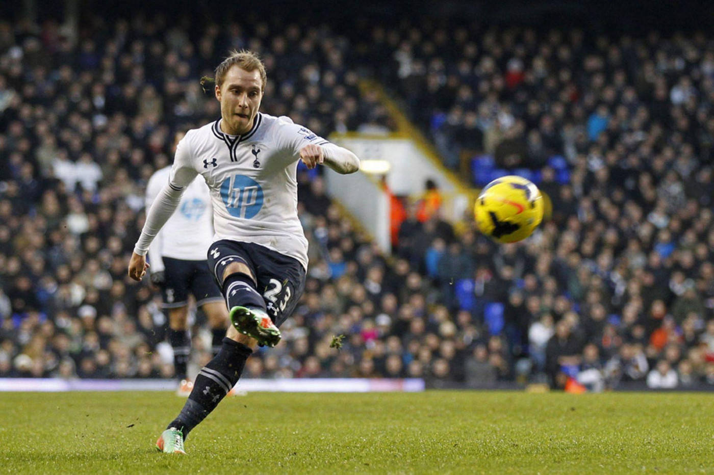 Christian Eriksen Wearing White And Kicking The Ball Background