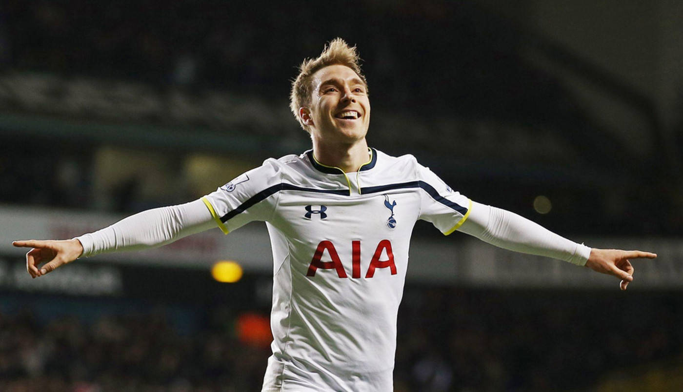 Christian Eriksen With His Arms Extended Out Background