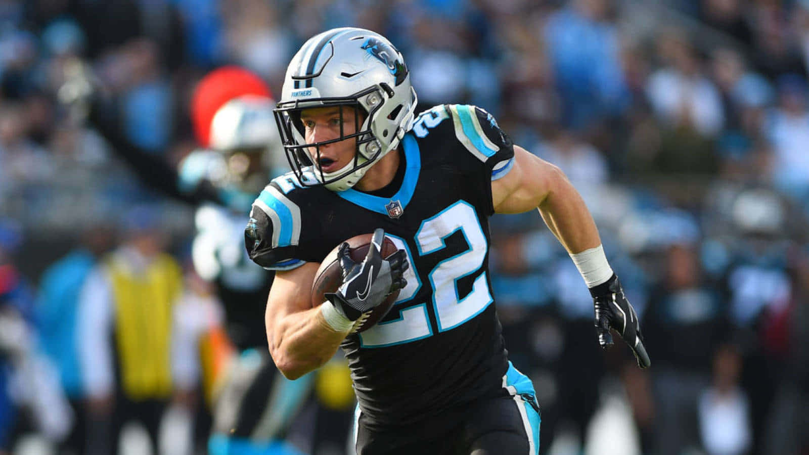 Christian Mccaffrey Breaking Off A Huge Gain For The Carolina Panthers Background