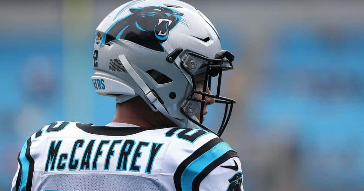 Christian Mccaffrey Playing Football As A Running Back For The Carolina Panthers Background