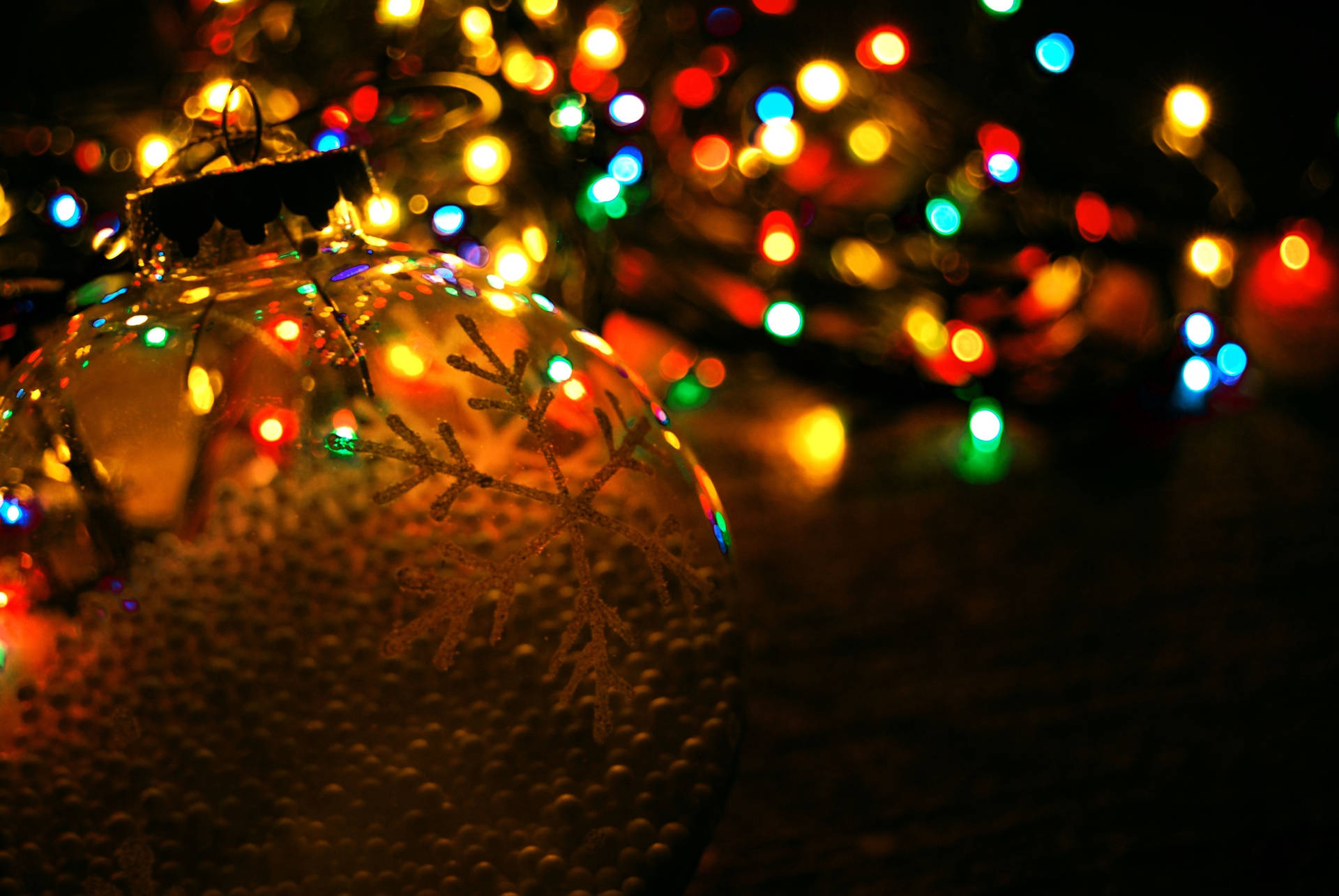 Christmas Ball Against Festive Lights Bokeh Shot