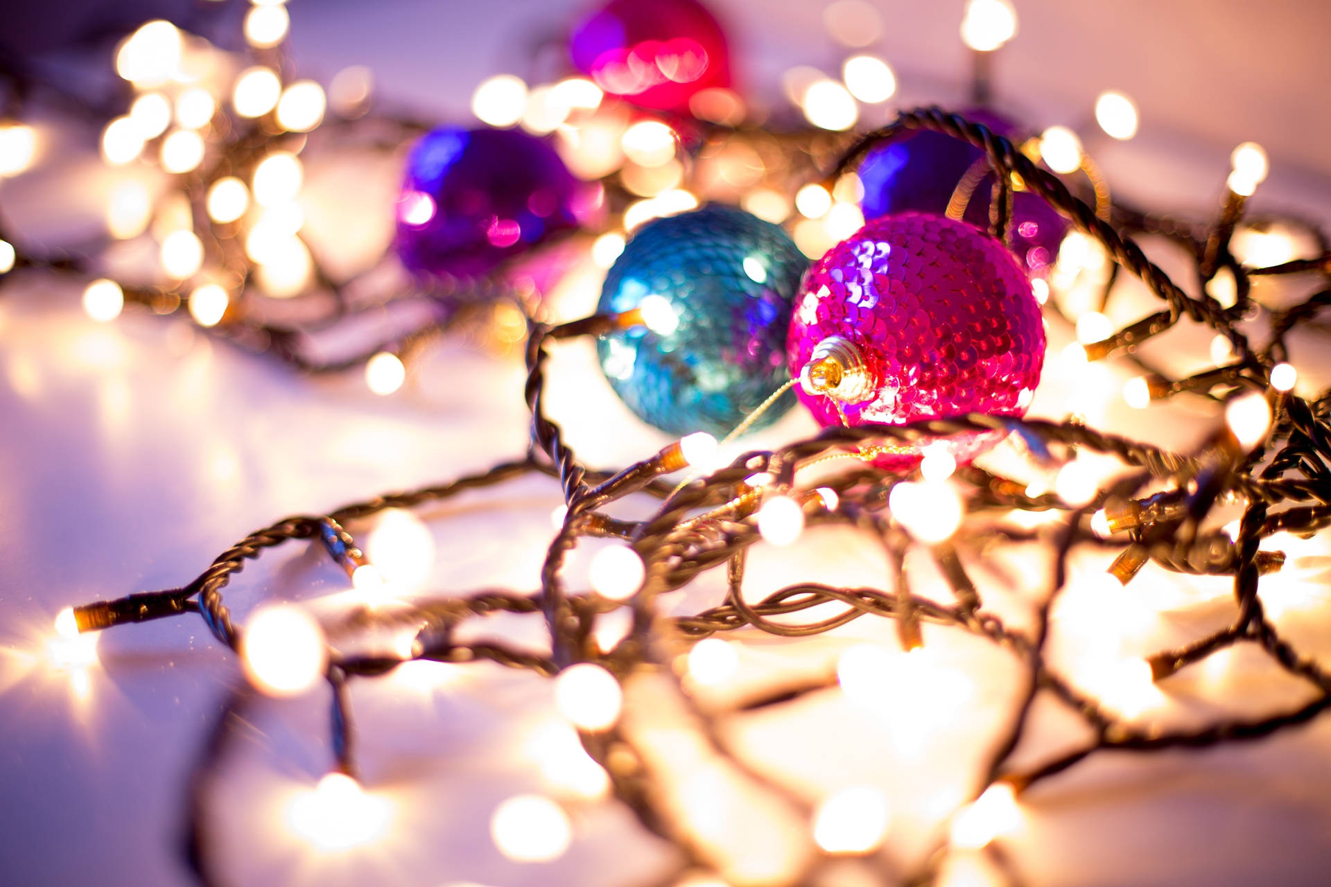 Christmas Balls And Yellow Festive Christmas Lights Tight Shot Background