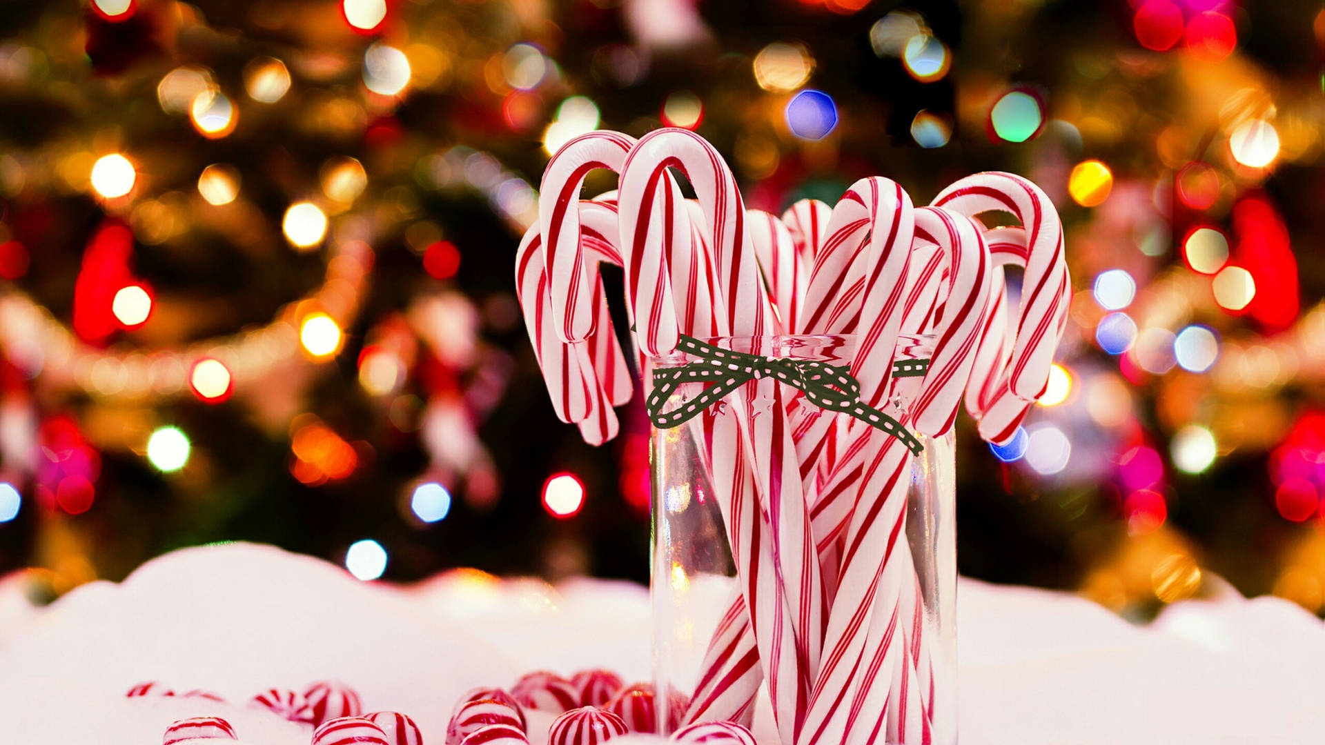 Christmas Candy Canes In Glass Background
