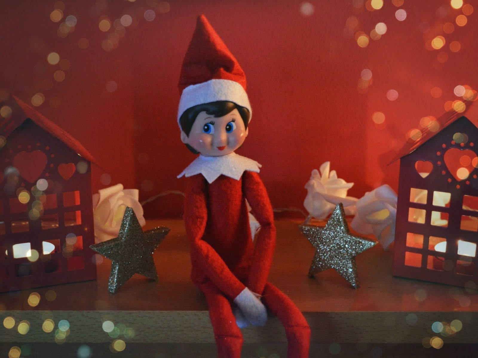 Christmas Elf Figurine On A Desk Background