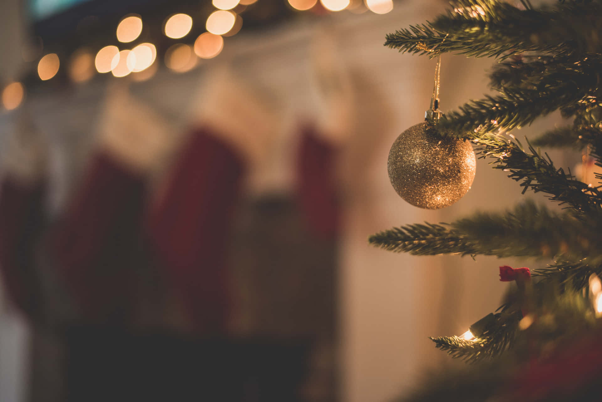 Christmas Tree With Stockings Hanging On It Background