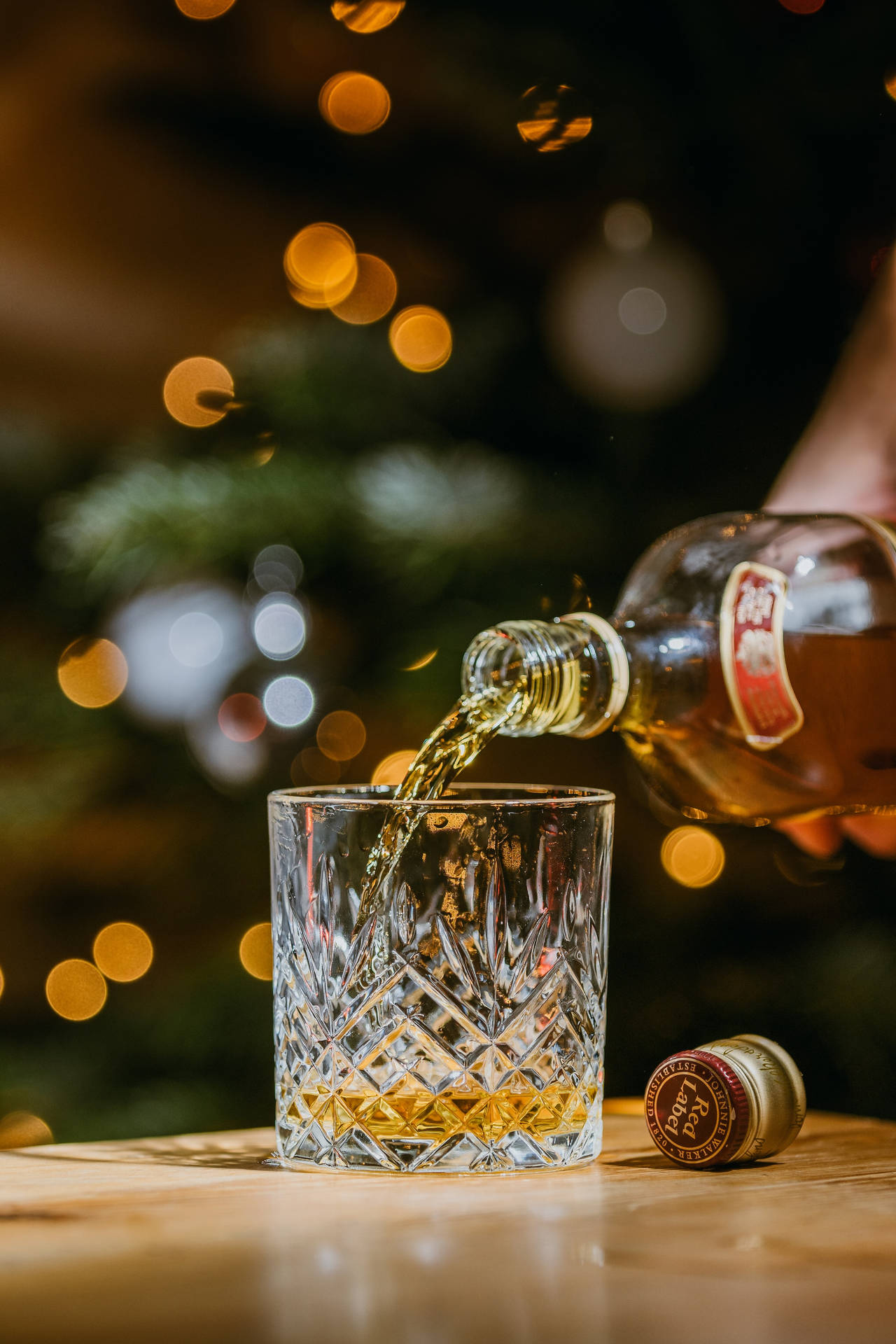 Christmas Whiskey Pouring On Glass Background