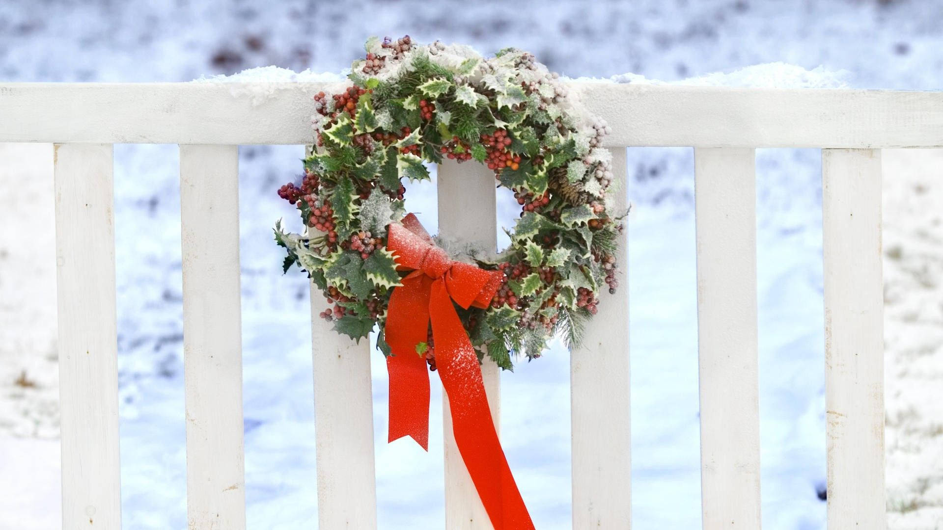 Christmas Wreath On White Fence Background