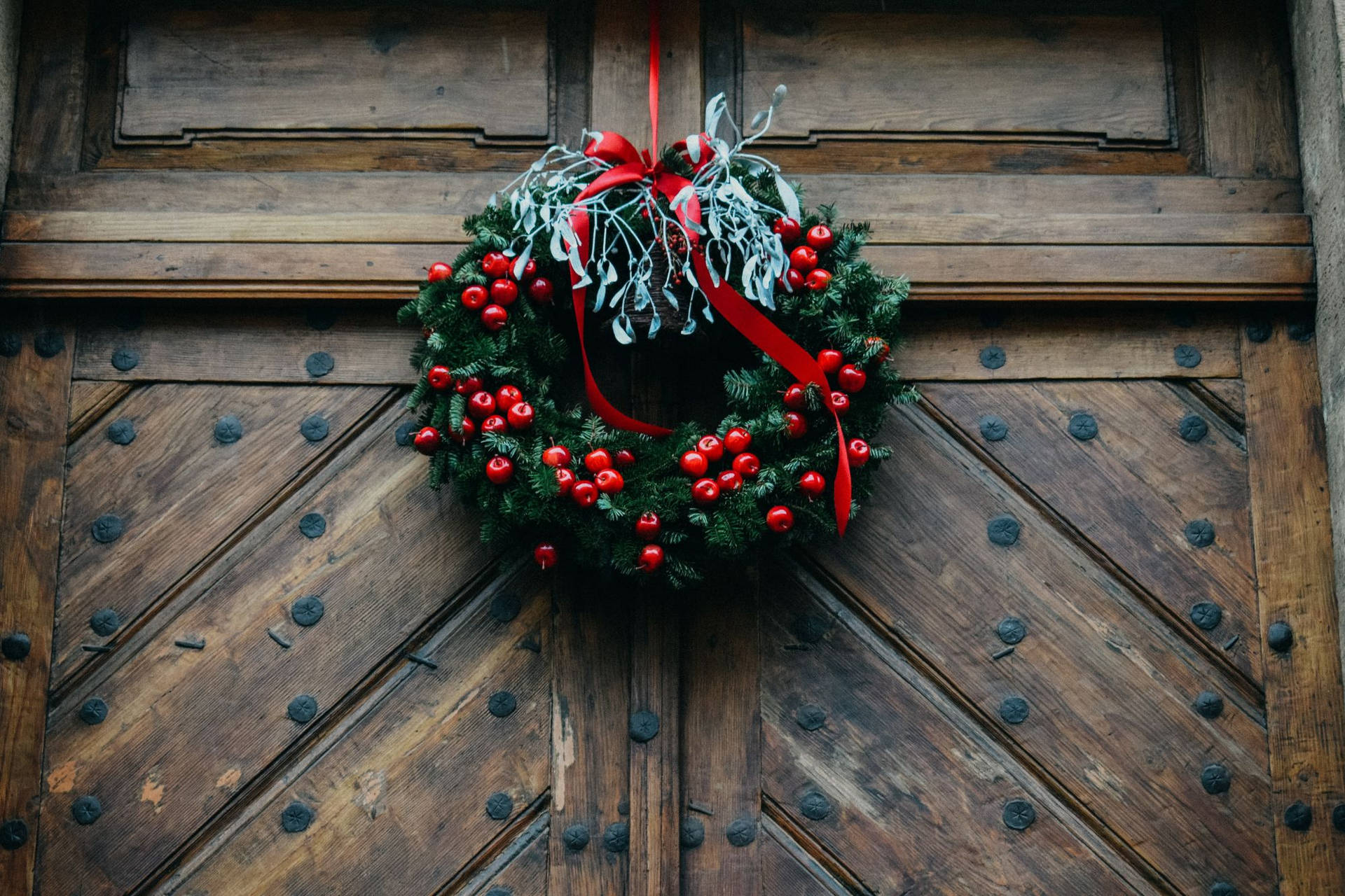Christmas Wreath On Wooden Door Background
