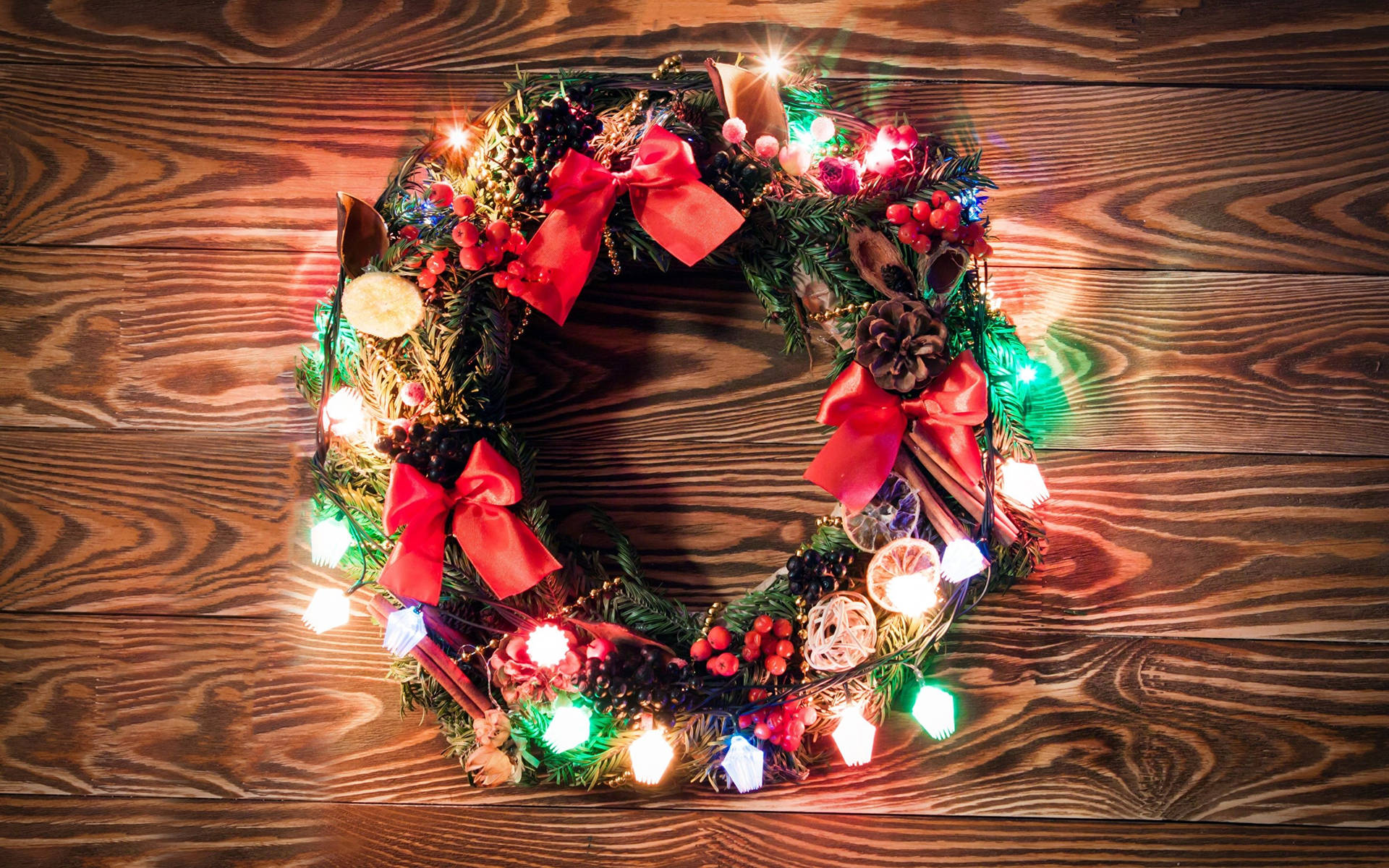 Christmas Wreath With Colorful Lights Background