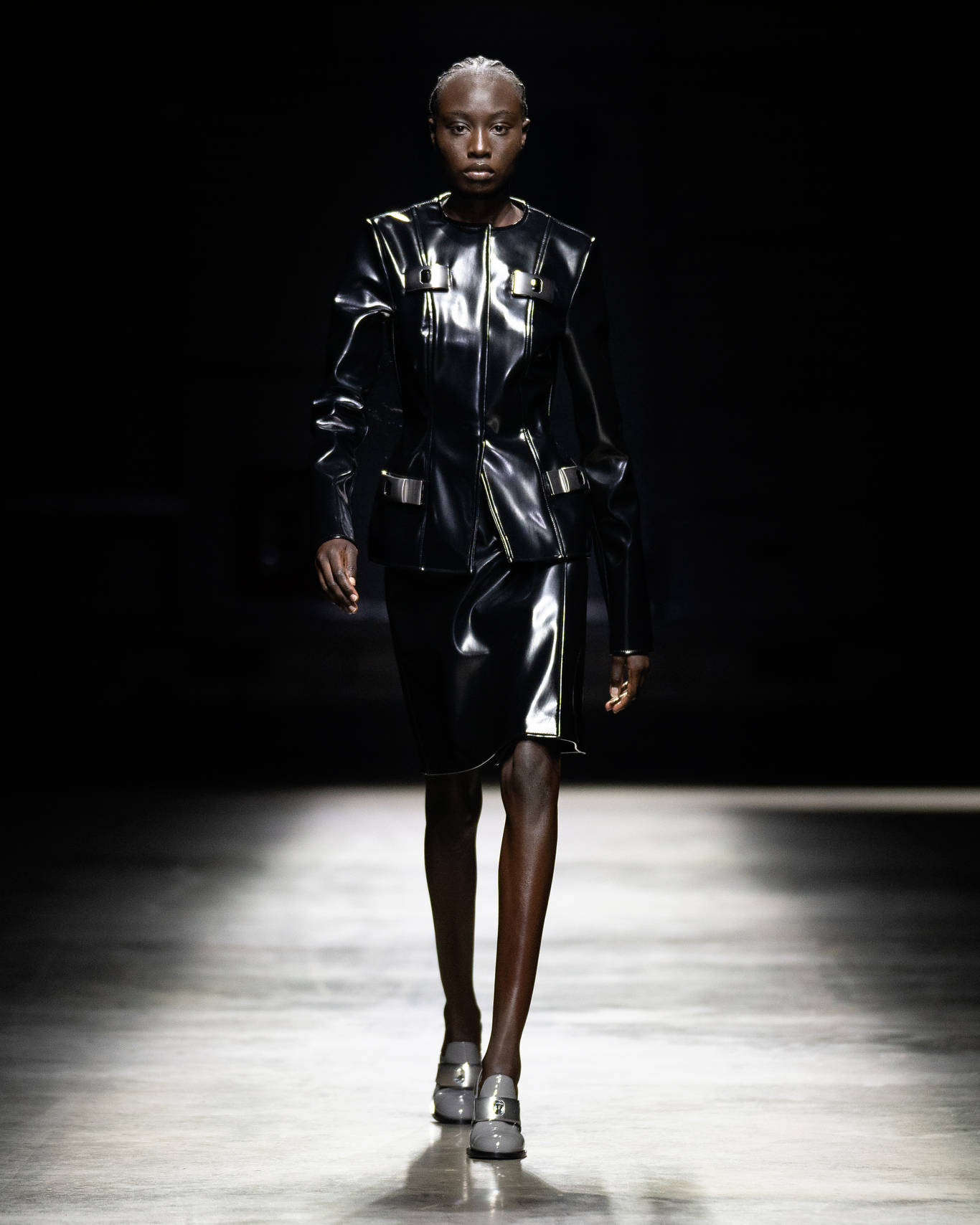 Christopher Kane's Signature Black Leather Dress Background