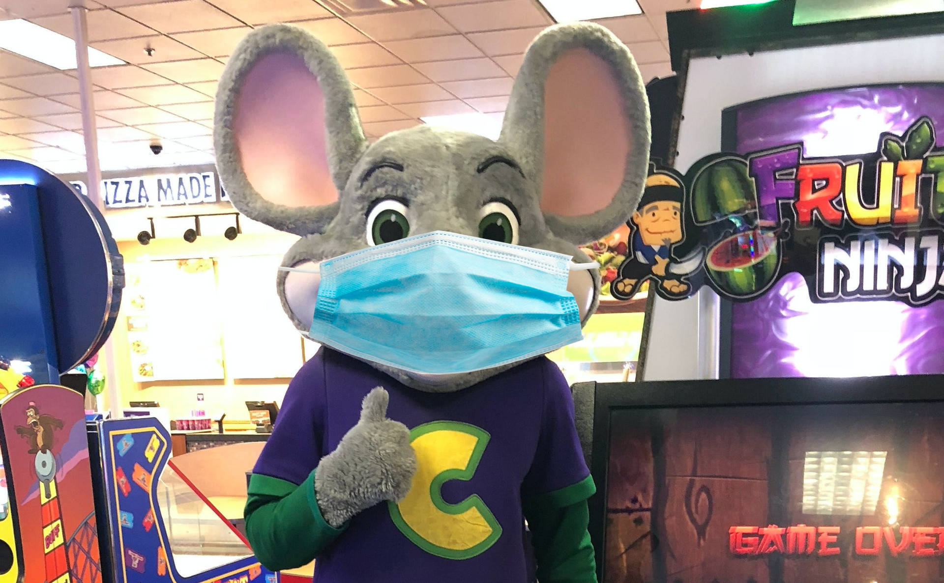 Chuck E Cheese Mascot With Mask Background
