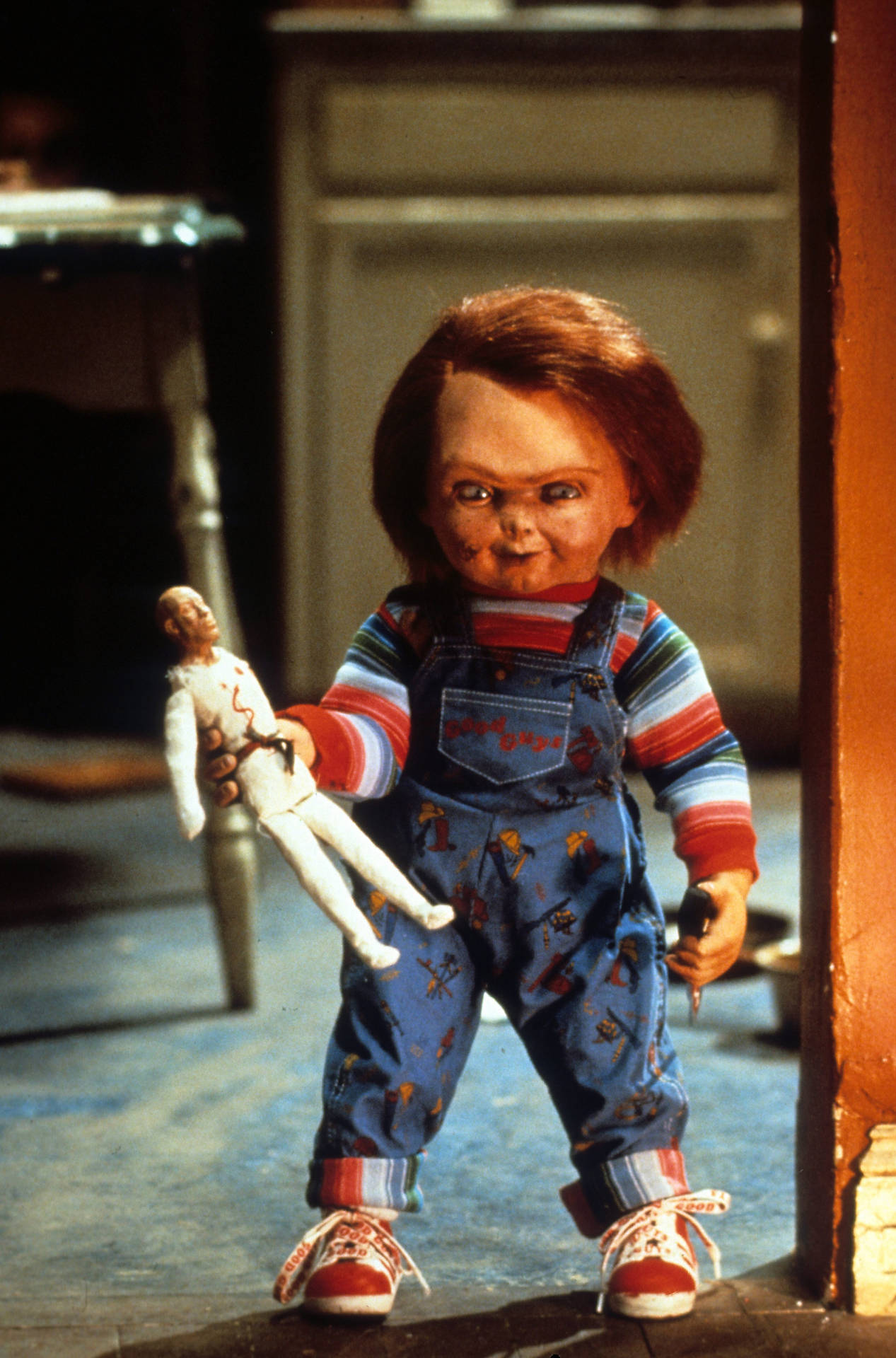 Chucky Holding Male Doll Background