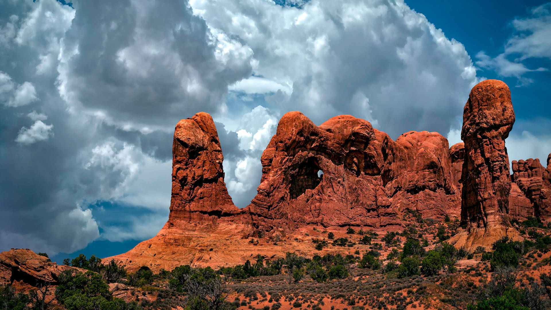 Chunky Clouds At Arches National Park Background