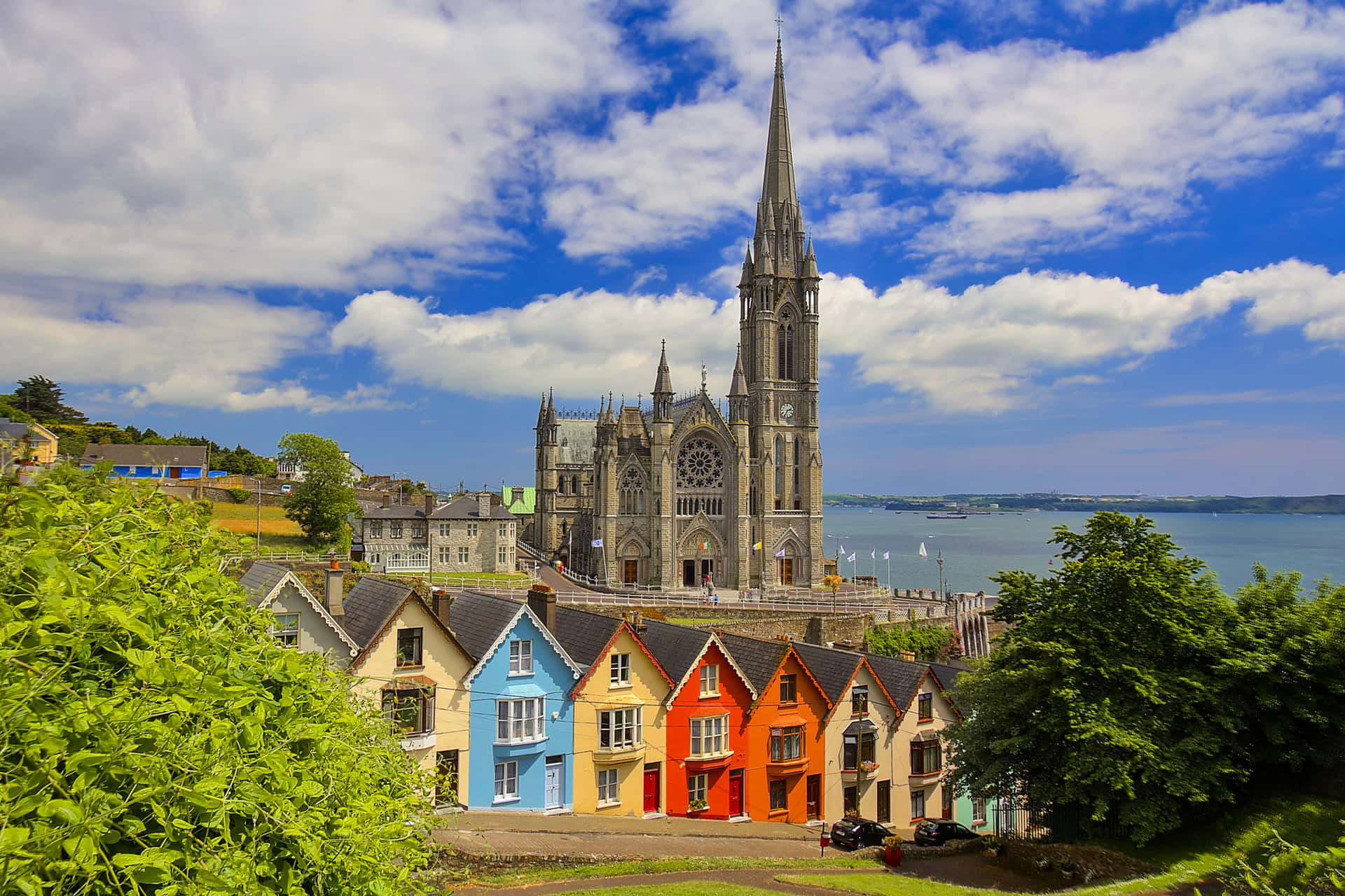 Church With Colorful Houses Ireland Desktop Background