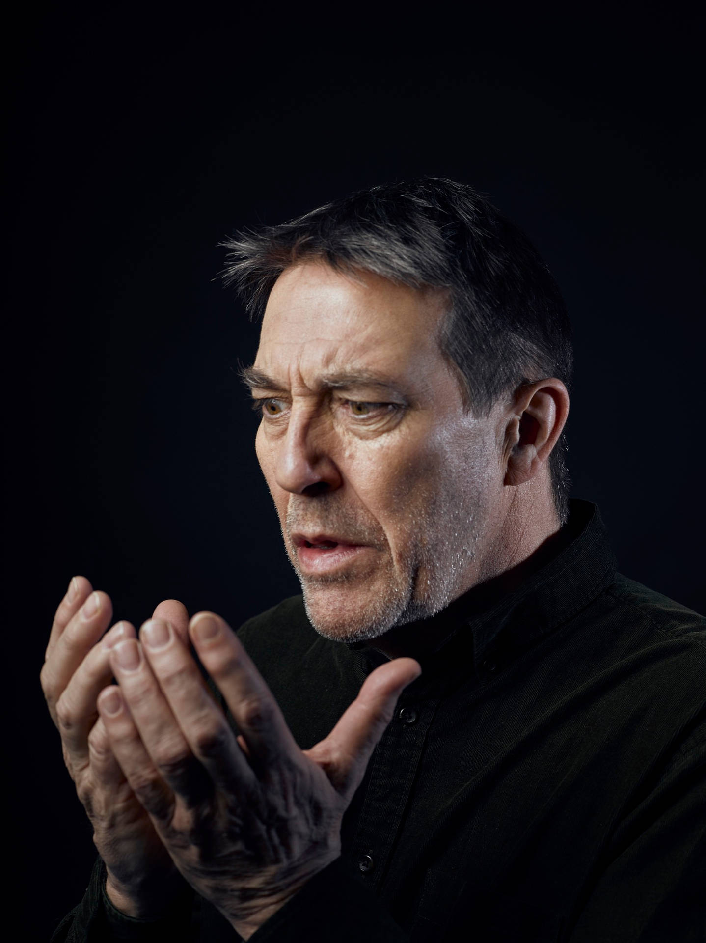 Ciarán Hinds Actor Portrait Sitting Background