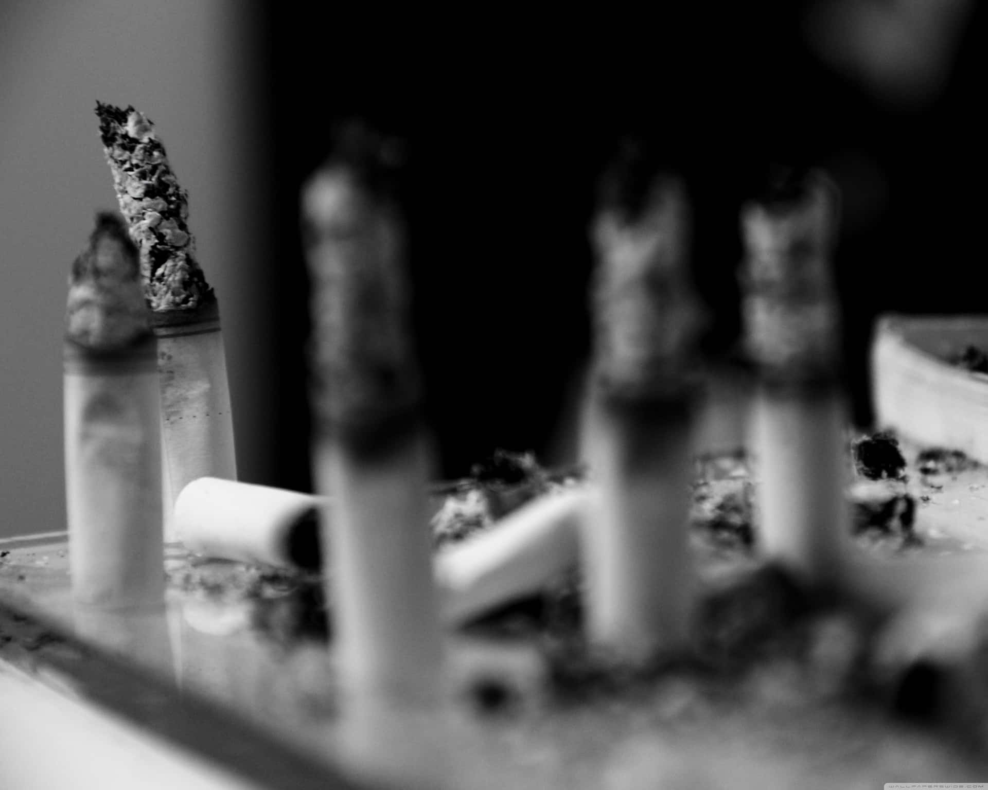 Cigarette Ash On A Table Background