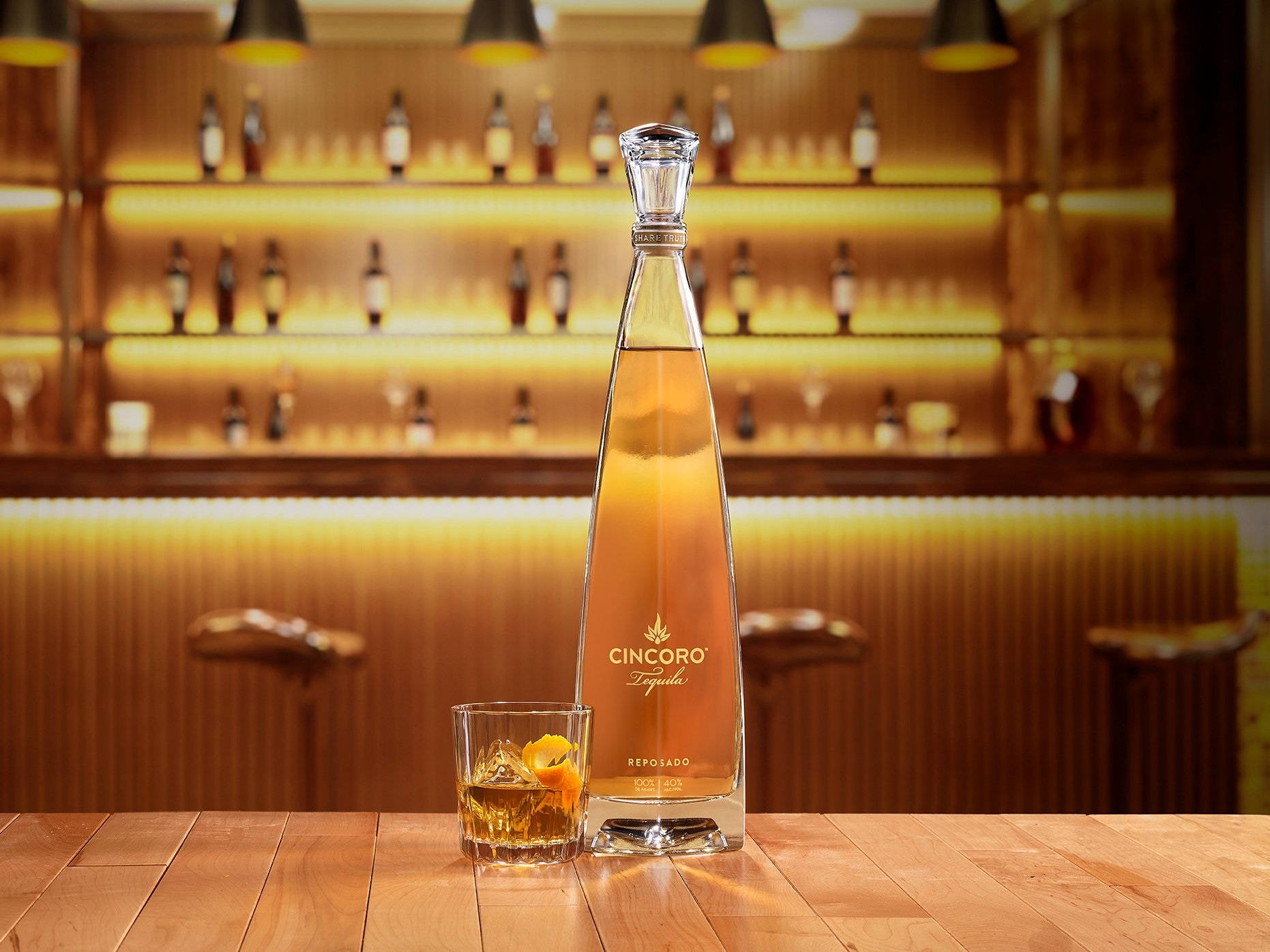 Cincoro Tequila Reposado Bottle On Bar Background