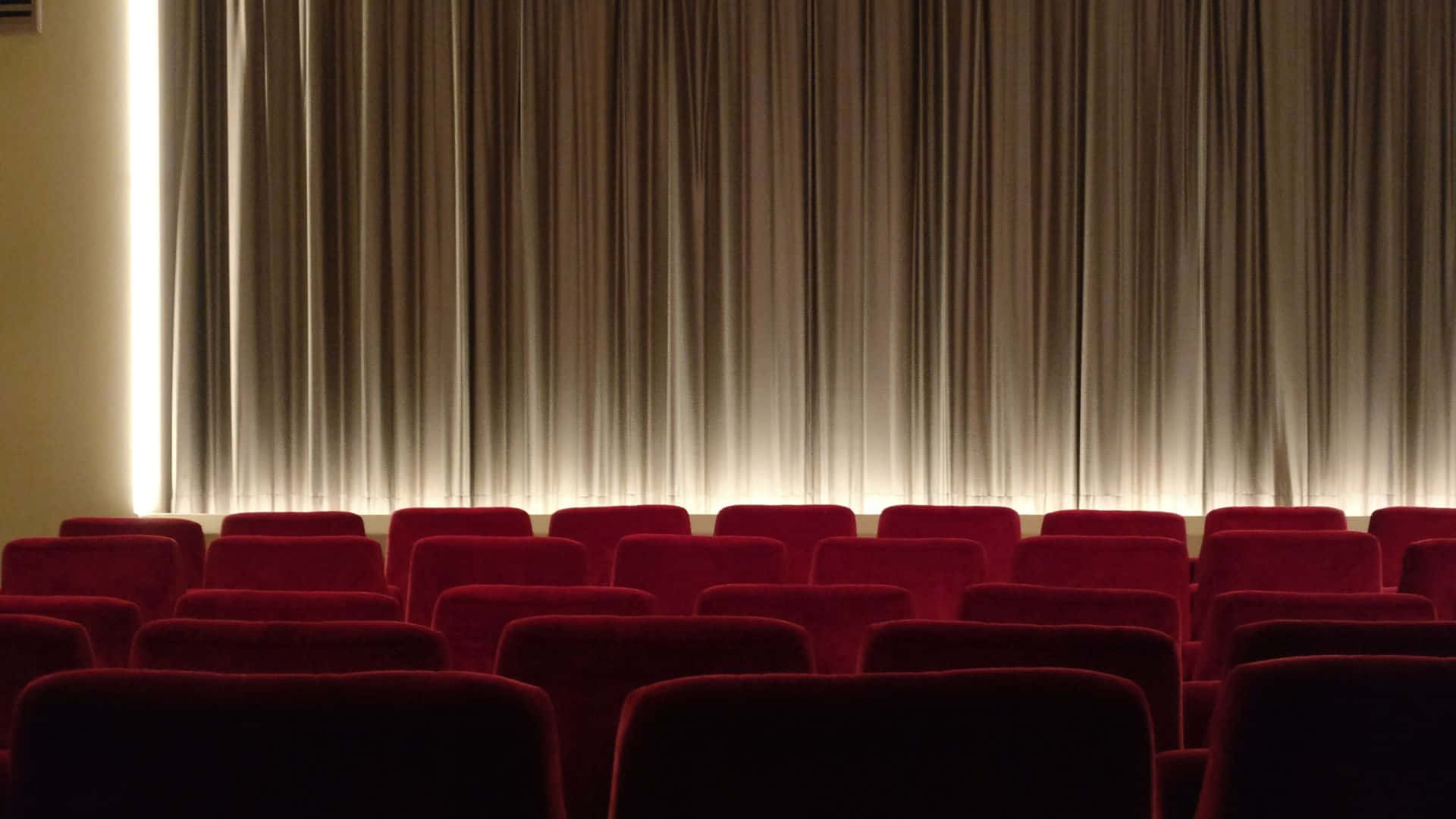 Cinema Interior Empty Seatsand Screen Background