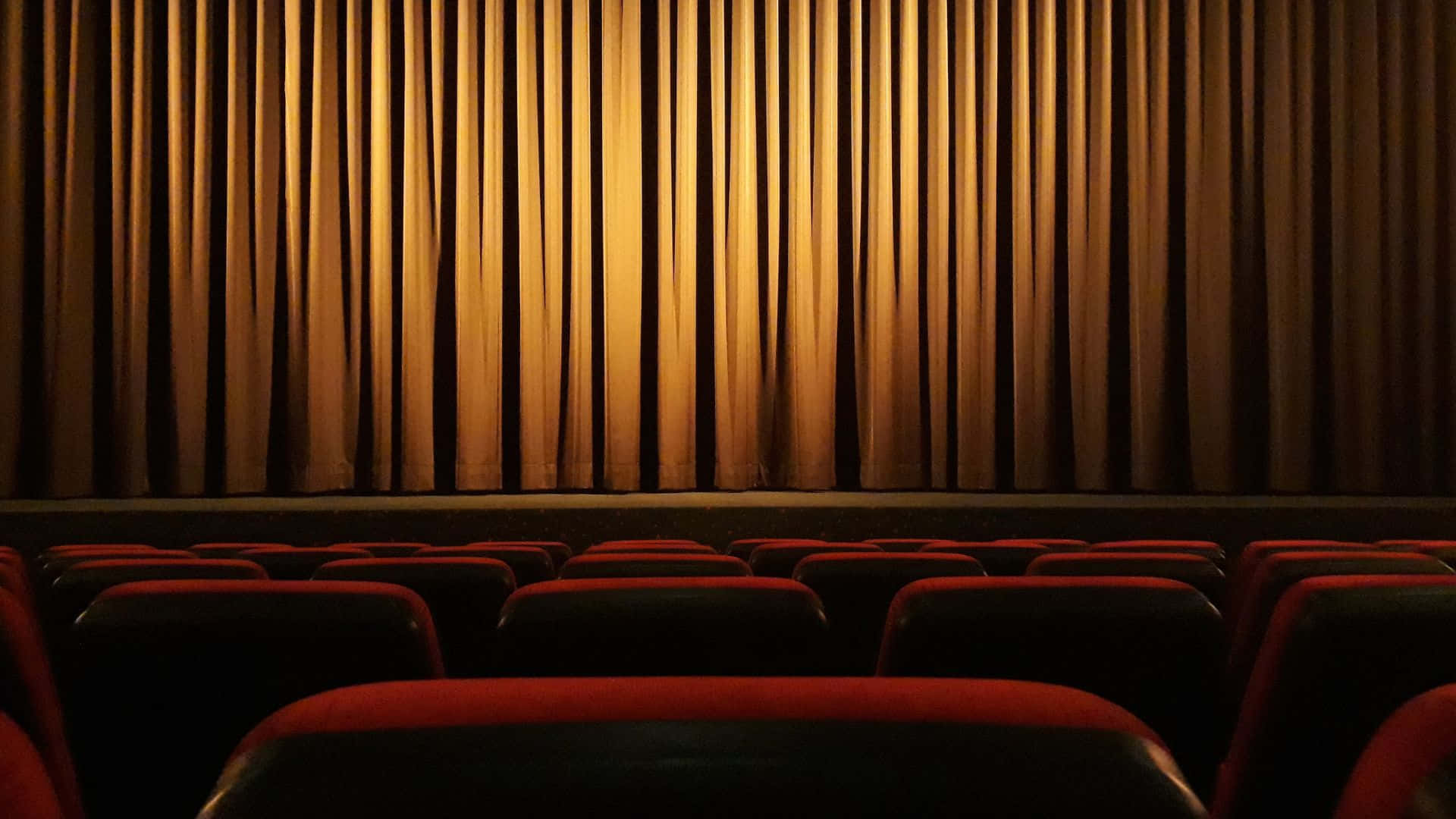 Cinema_ Theater_ Interior_with_ Curtains_and_ Seats Background