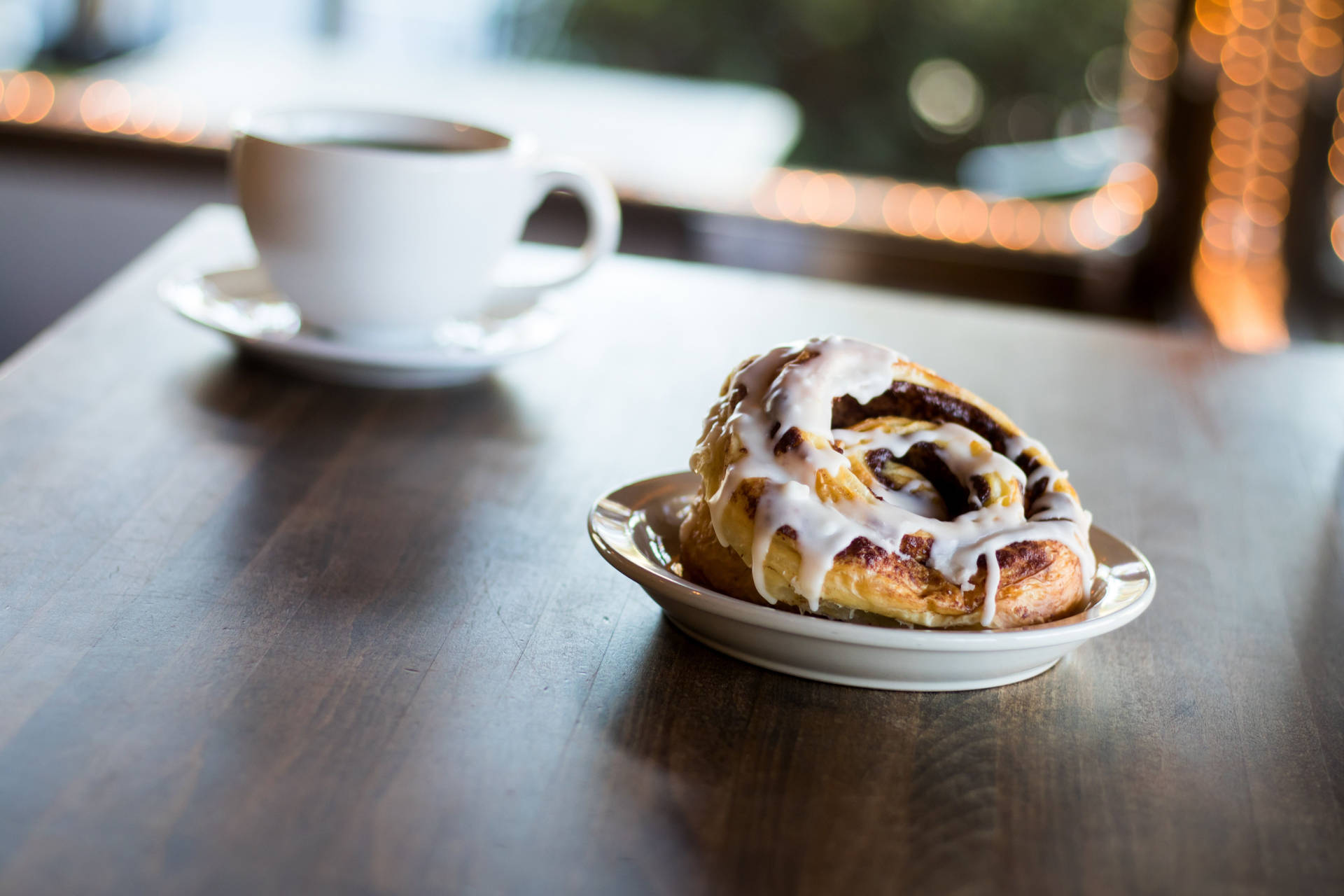 Cinnamon Bun To Go With Coffee Background