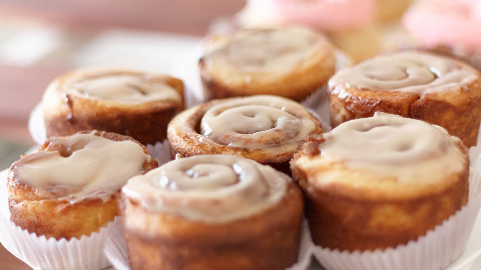 Cinnamon Buns In Muffin Liners Background