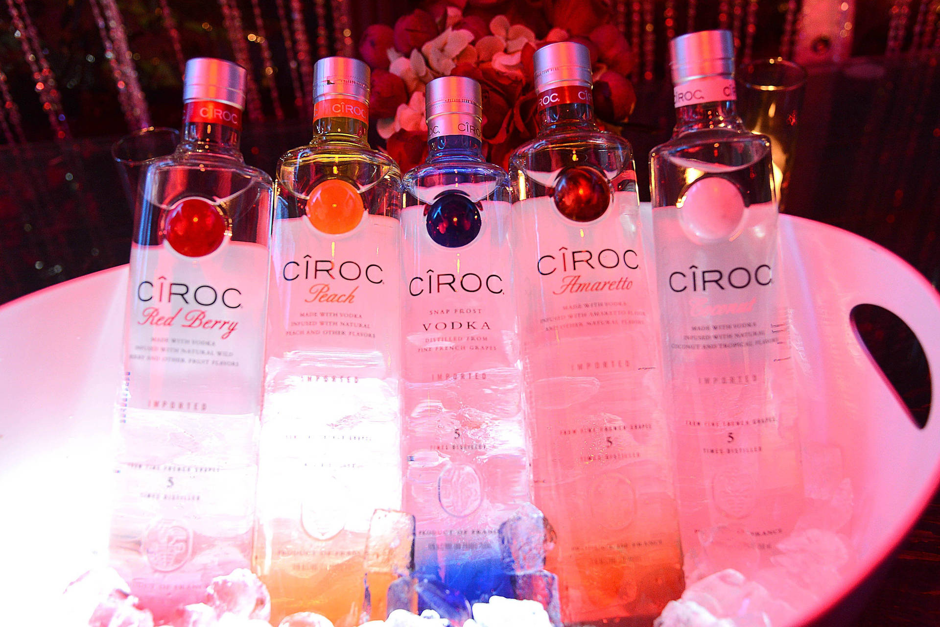 Ciroc French Vodka Bottles In Ice Container Background