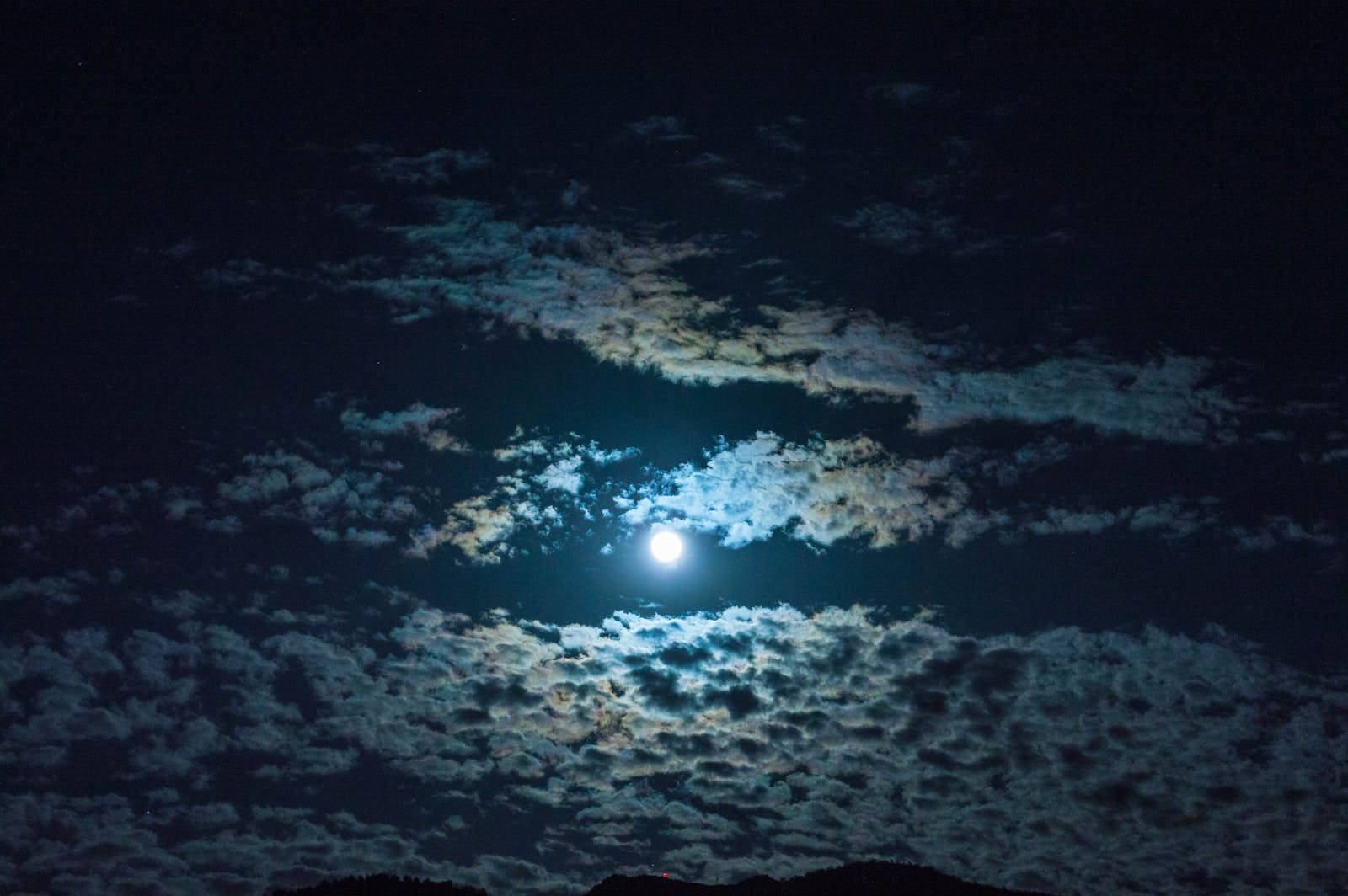 Cirrus Clouds In Moonlight Background