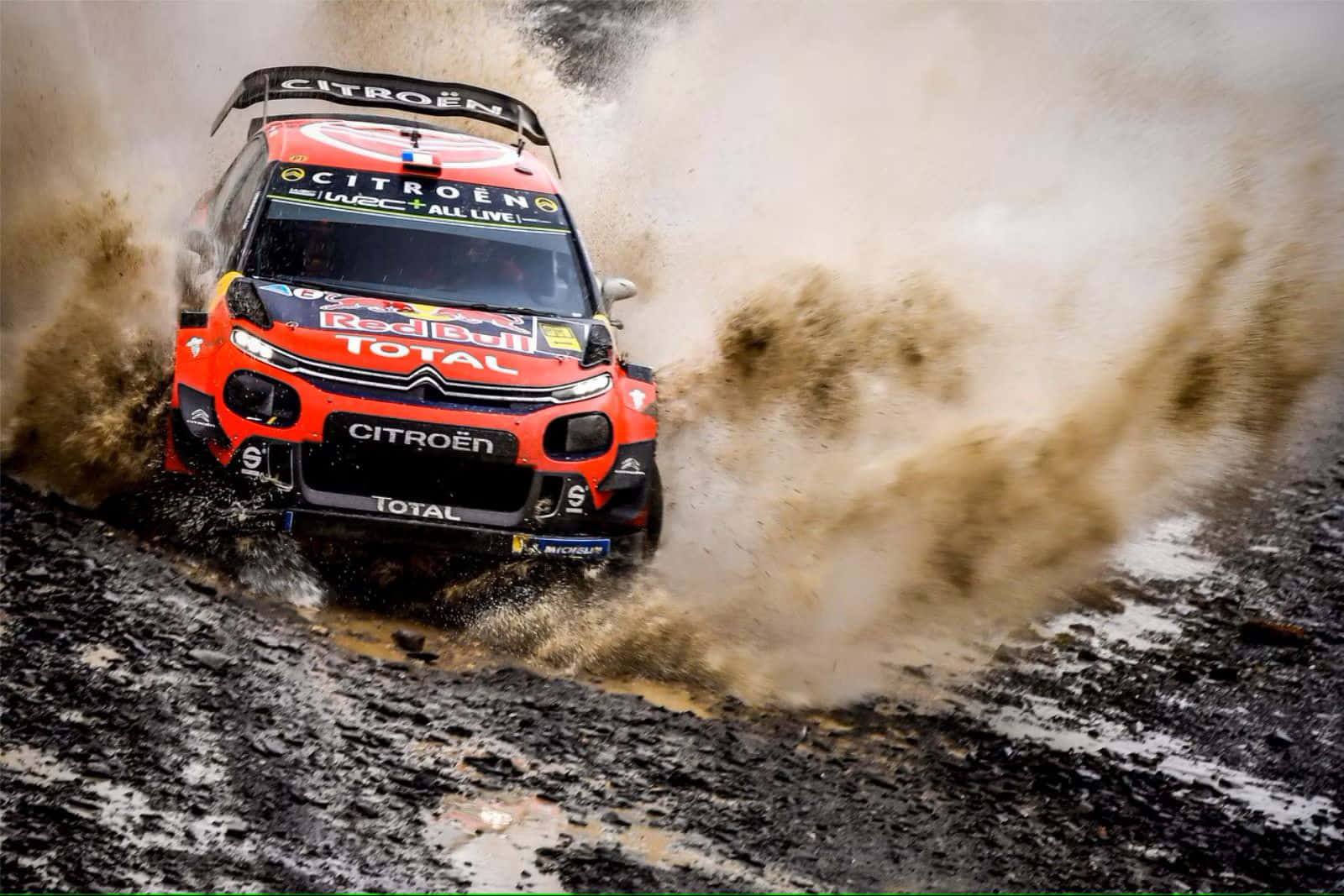 Citroen Rally Car Splashing Mud Background