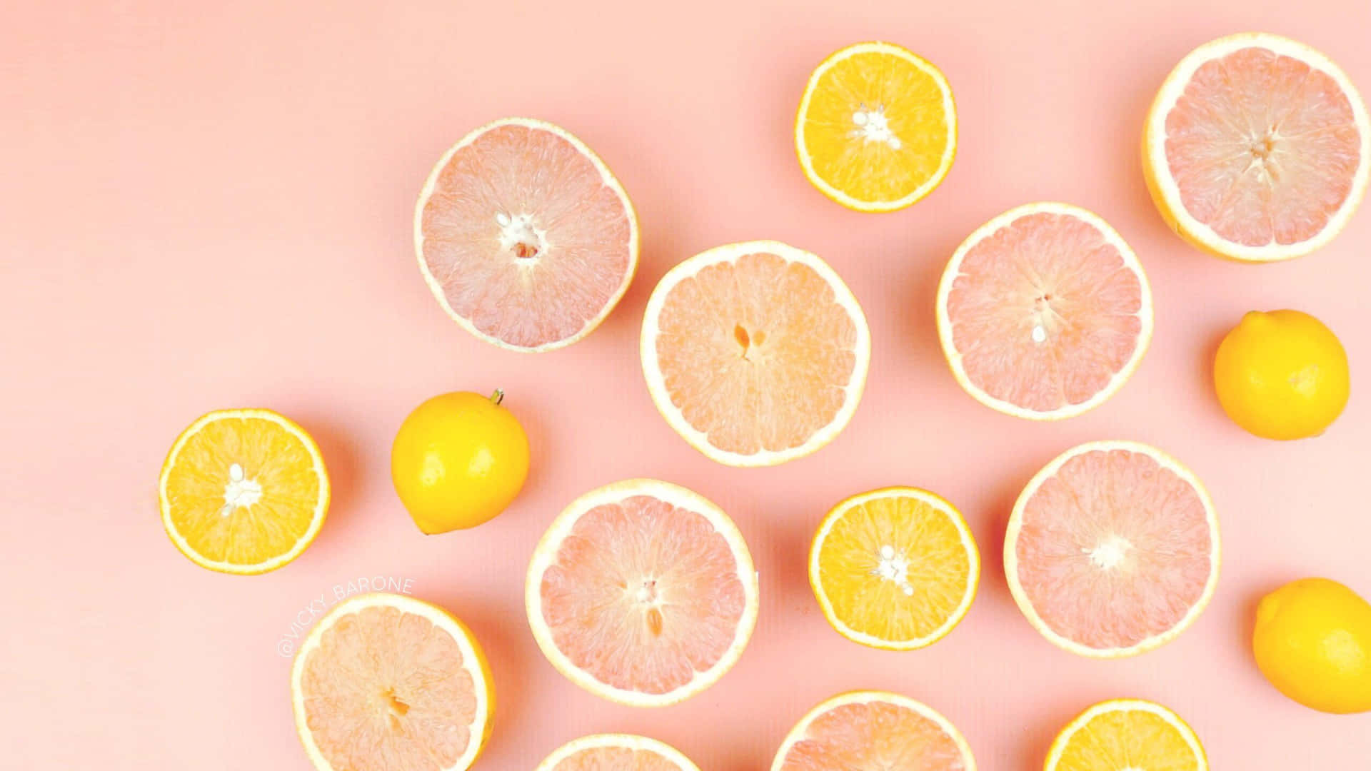 Citrus Fruit Assortment Pink Background