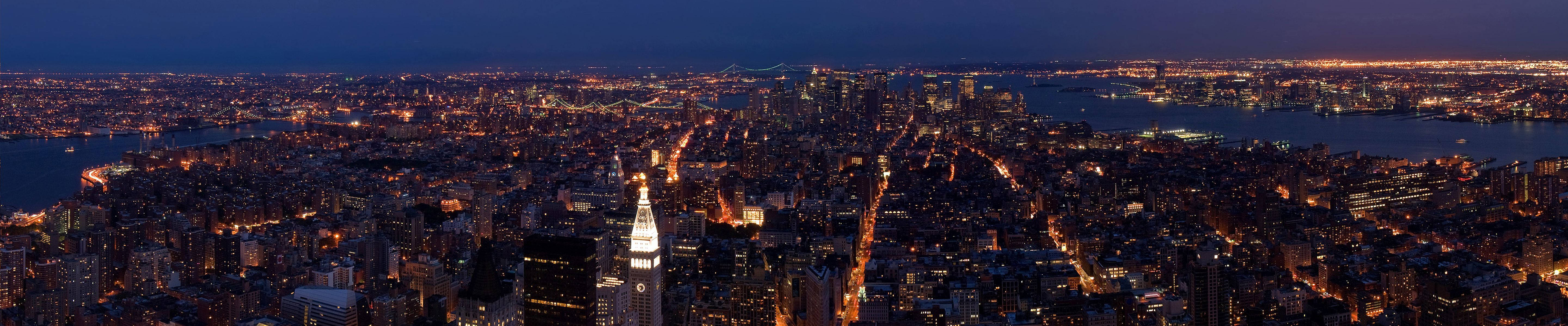 City Skyline At Night Three Screen Background