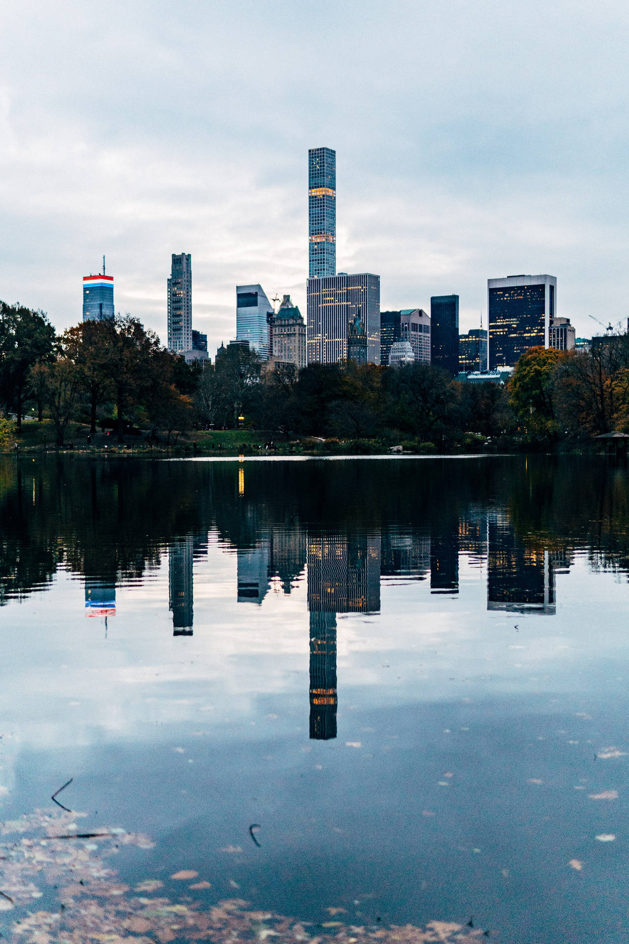 Cityscape Reflection In Central Park Background