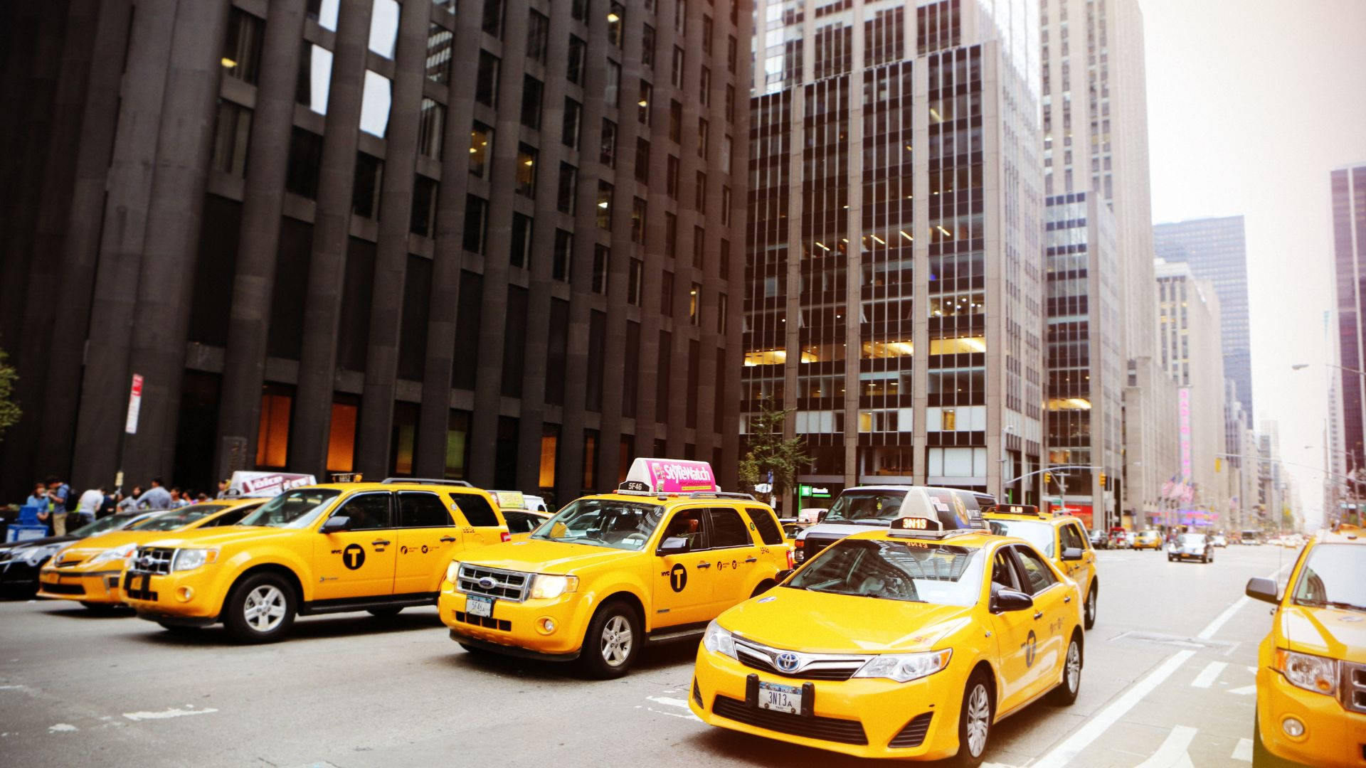 Cityscape With A Fleet Of Taxis Background