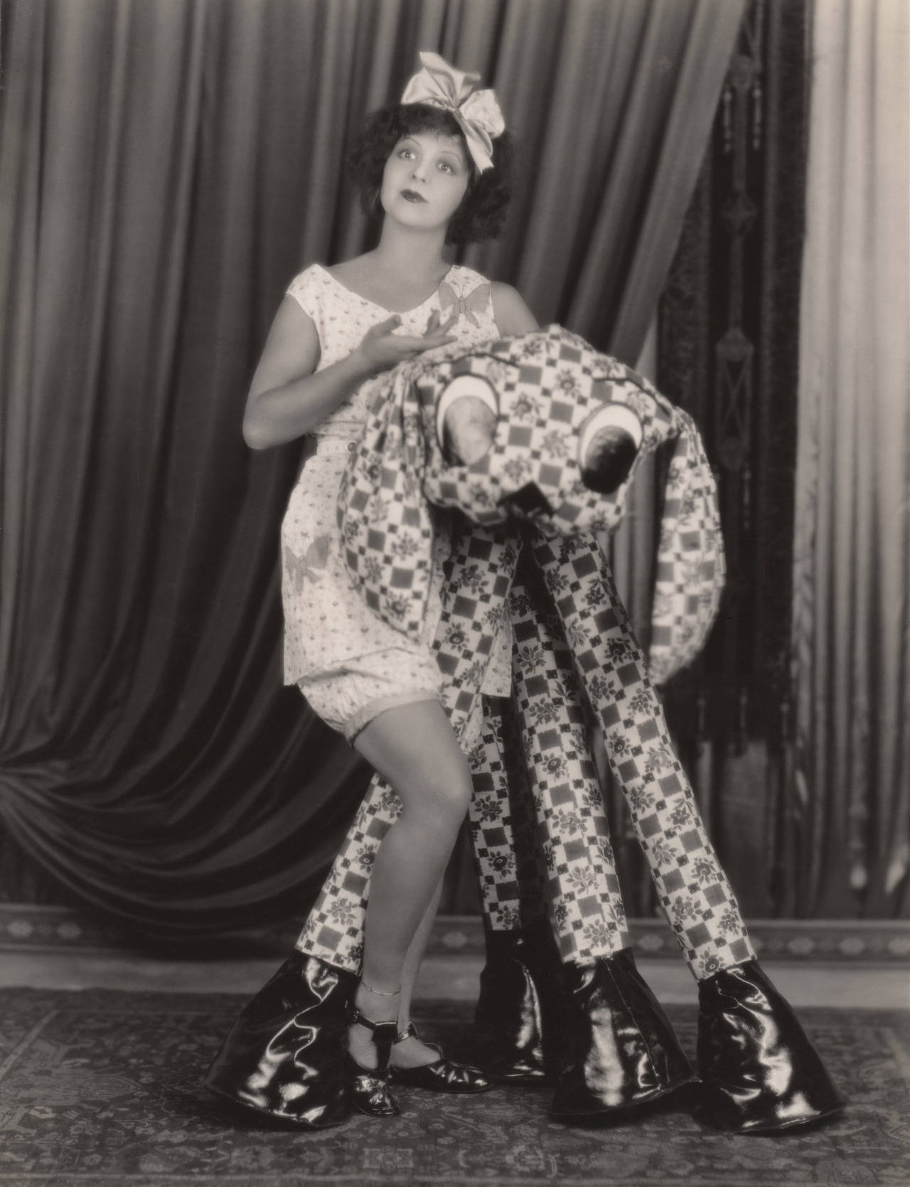 Clara Bow And Long Leg Stuffed Toy Background