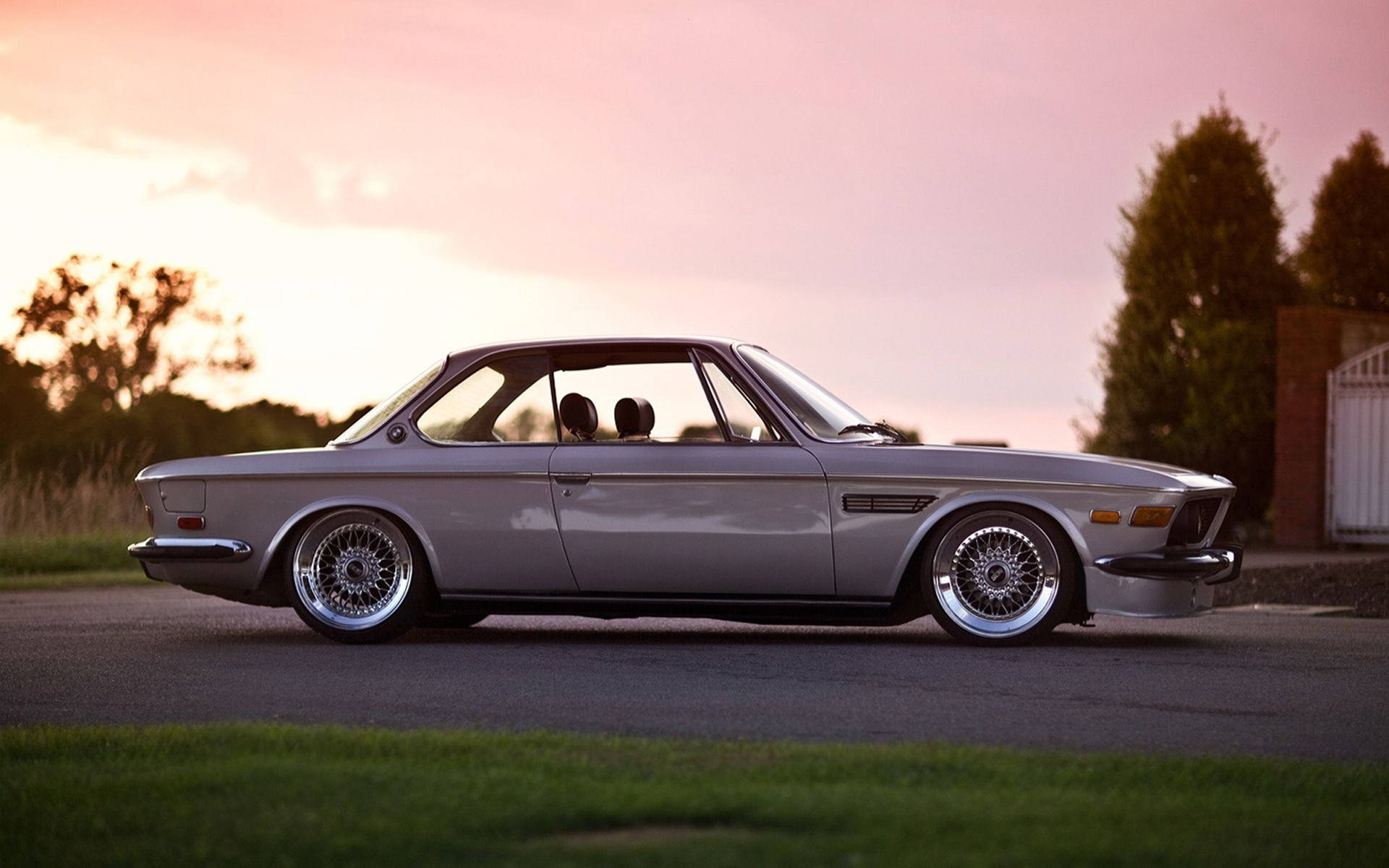 Classic Bmw At Dusk Background
