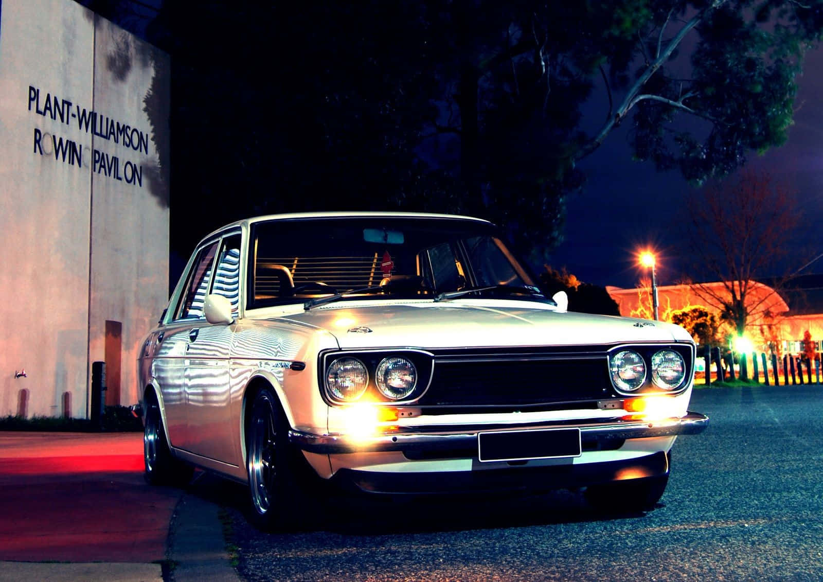 Classic Datsun 1600 Cruising On The Open Road Background