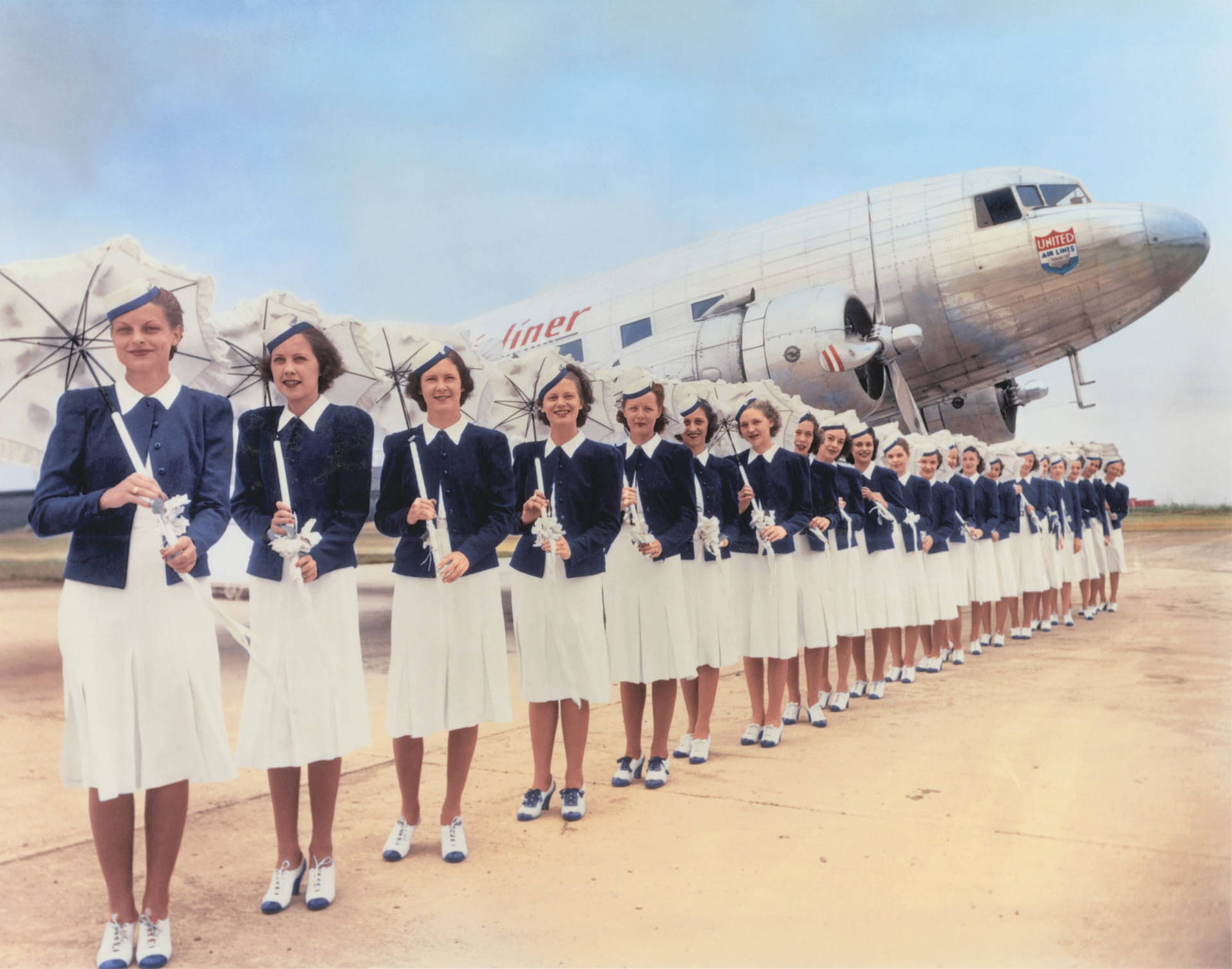 Classic Era Of Aviation With Trans World Airlines Flight Attendants Background