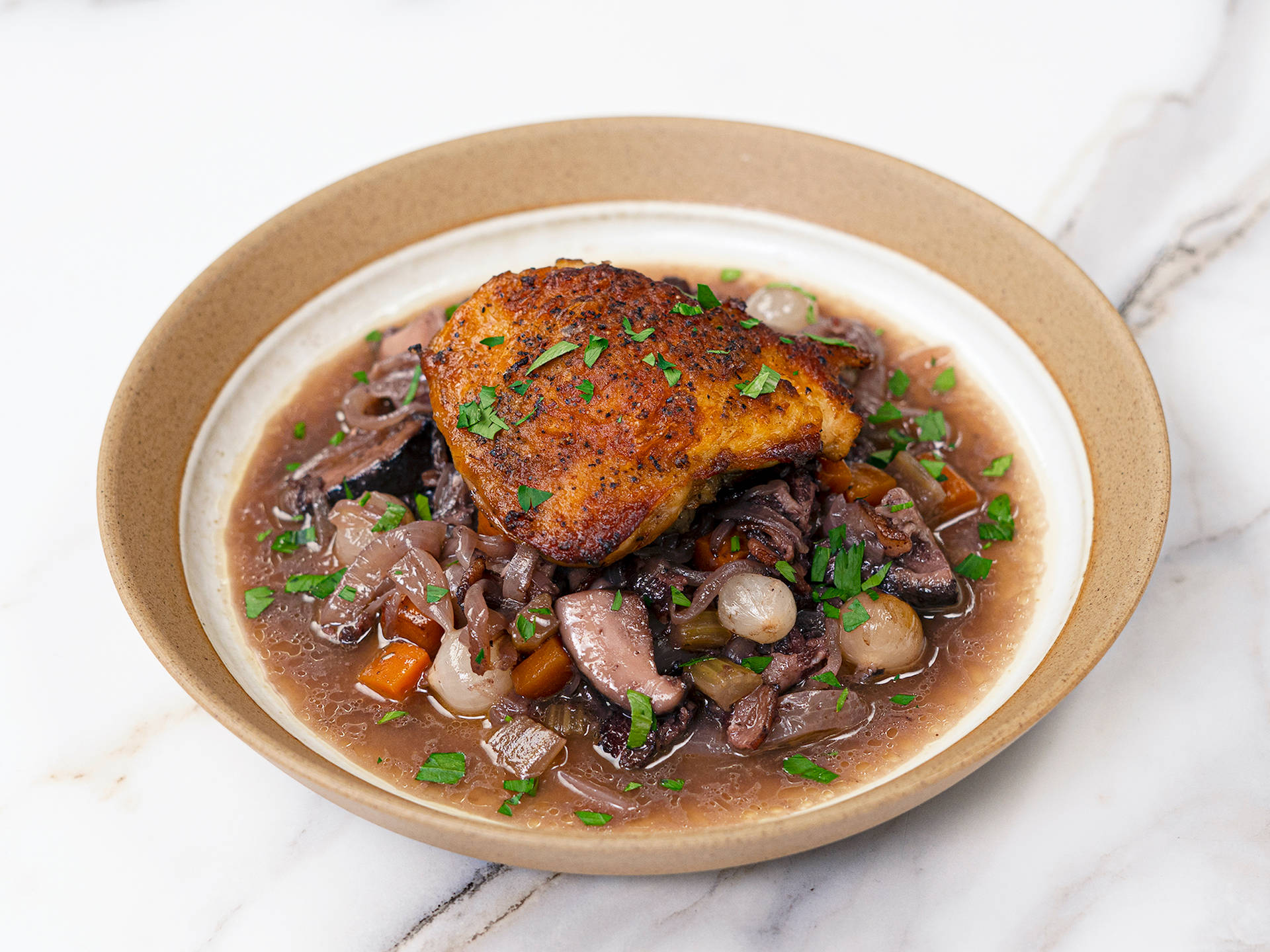 Classic French Coq Au Vin In Hearty Sauce Background