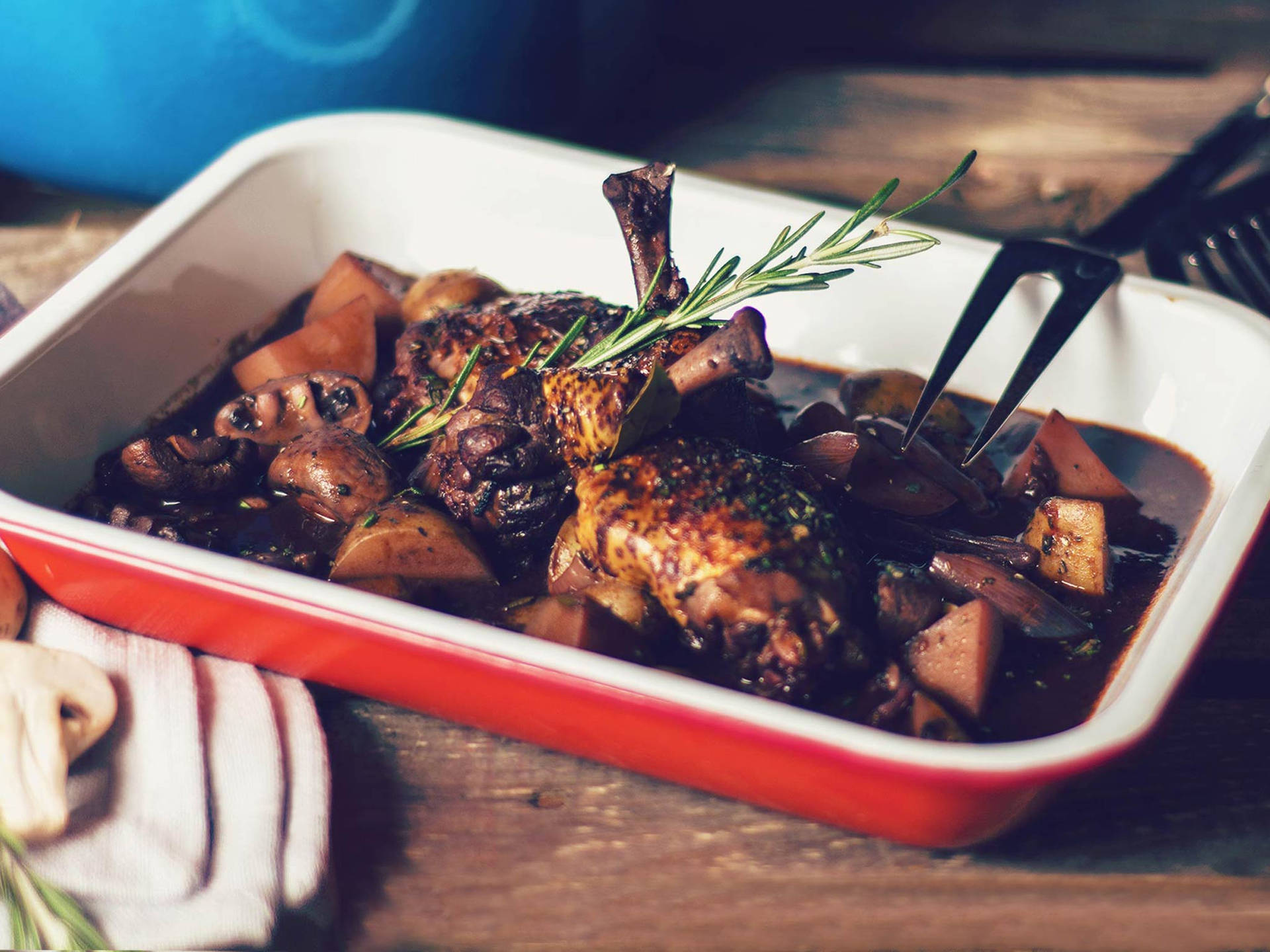 Classic French Coq Au Vin On A Rectangular Plate Background